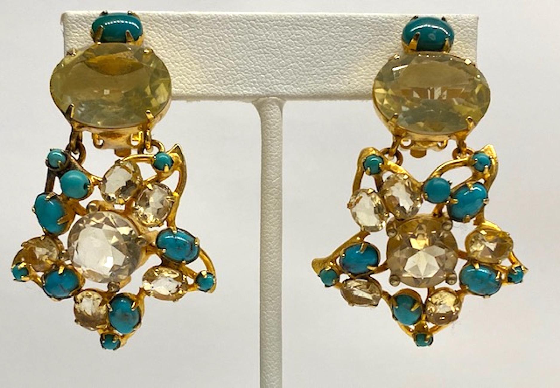 Lovely pair of Bounkit flower pendant earrings. Gold tone setting. Top of each earring has a turquoise cabochon sitting above a large 18 mm wide by 13 mm high oval lemon quartz and a clip backing inscribed Bounkit. Suspended from the top is a 1.38