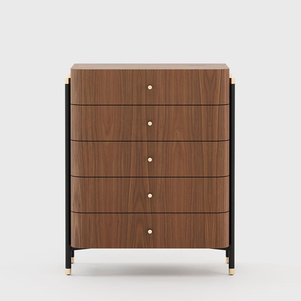 Chest of drawers bount with structure in walnut wood in matte 
finish. Nightstand or side table with 5 drawers. With blackened 
iron feet with polished stainless steel details in gold finish.
Also available with other wood finishes on request.