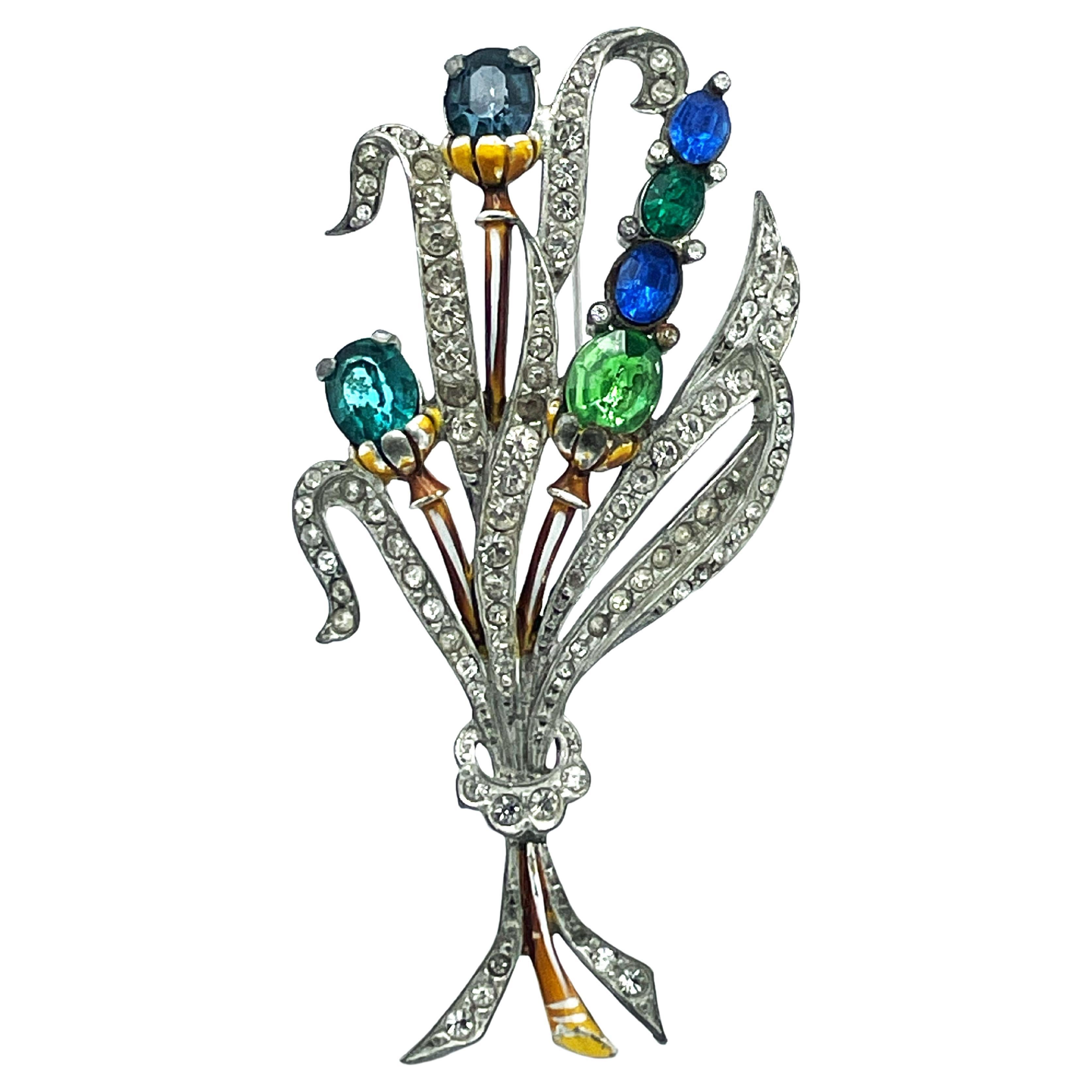 Bouquet brooch from the 1930/40s with blue, green and clear rhinestones, potash  For Sale