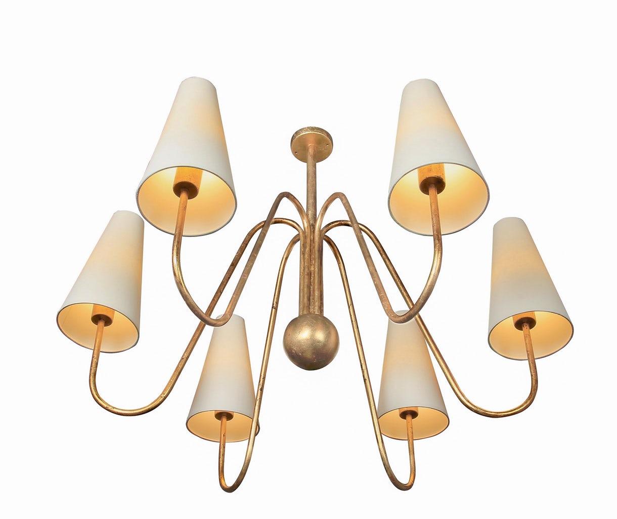 Edition modern six-arm gold-leaf chandelier. Executed in high quality gold-leafed metal with rigid parchment shades, this ultra refined design adds a sculptural element and focal point of incomparable beauty.

Price is per item. Current variant