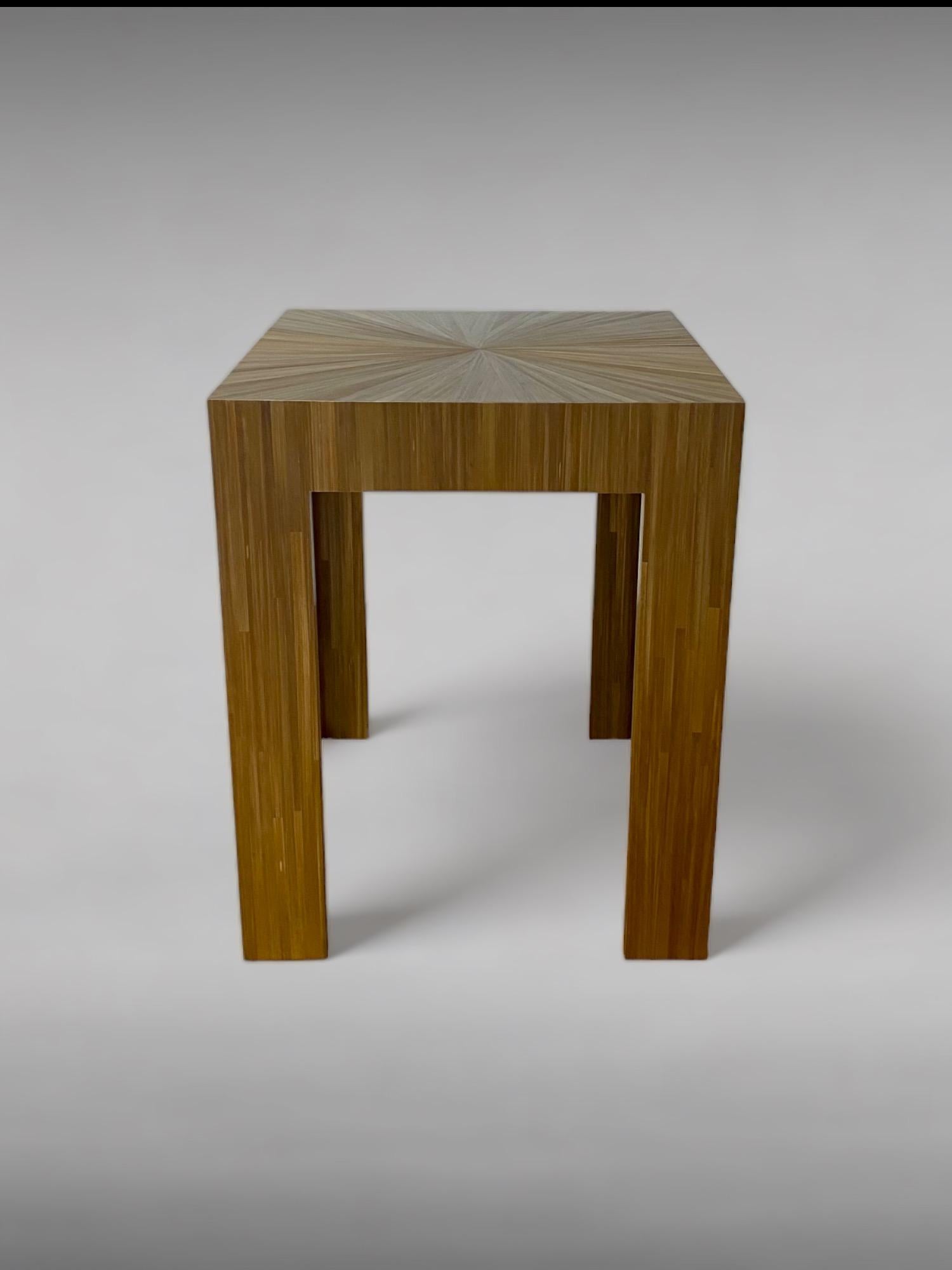 Jean-Michel Frank designs are prized for their serene and simple beauty. Available in more than 60 colors in straw marquetry motif, this striking side table showcases the nuanced hues and textures achieved through Frank’s precision in technique and