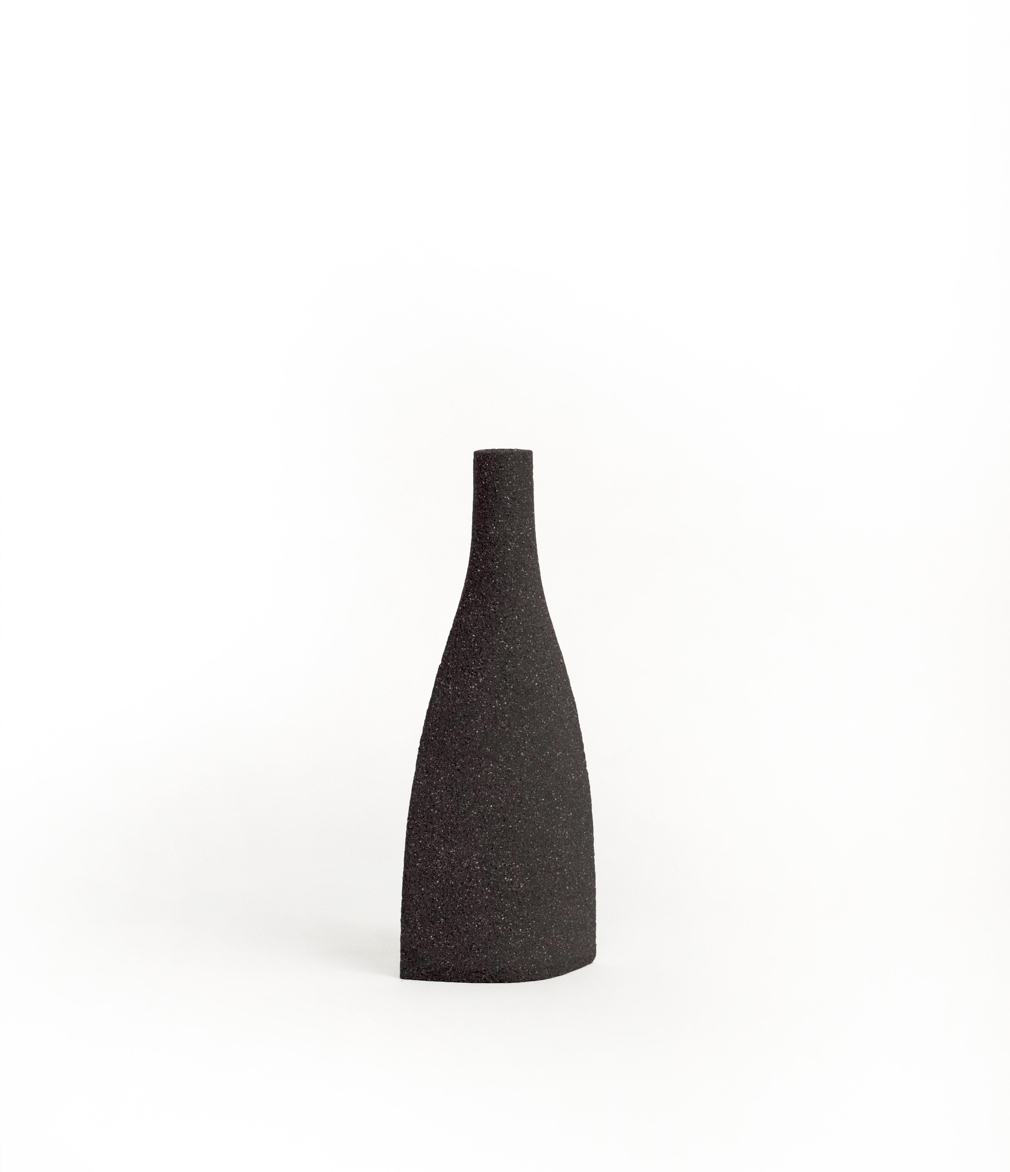 Bouteille [s] - black

Hand-crafted in our studio in France.

Measures: H: 21 CM / L: 8 CM
H: 11 INCH. / L: 4 INCH.

- Stoneware fired at high temperature finished with transparent glossy glaze inside.
- Raw exterior showcasing the natural