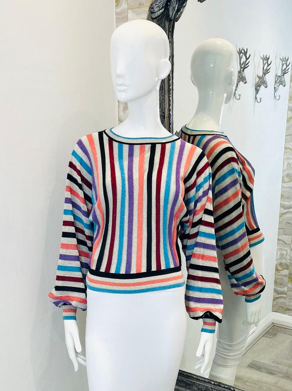 Boutique Moschino Metallic Striped Jumper

Multicoloured jumper designed with vertical metallic striped pattern.

Featuring round neckline, balloon sleeves and ribbed cuffs and hem. Rrp £268

Size – 38IT

Condition – Very Good

Composition – 70%