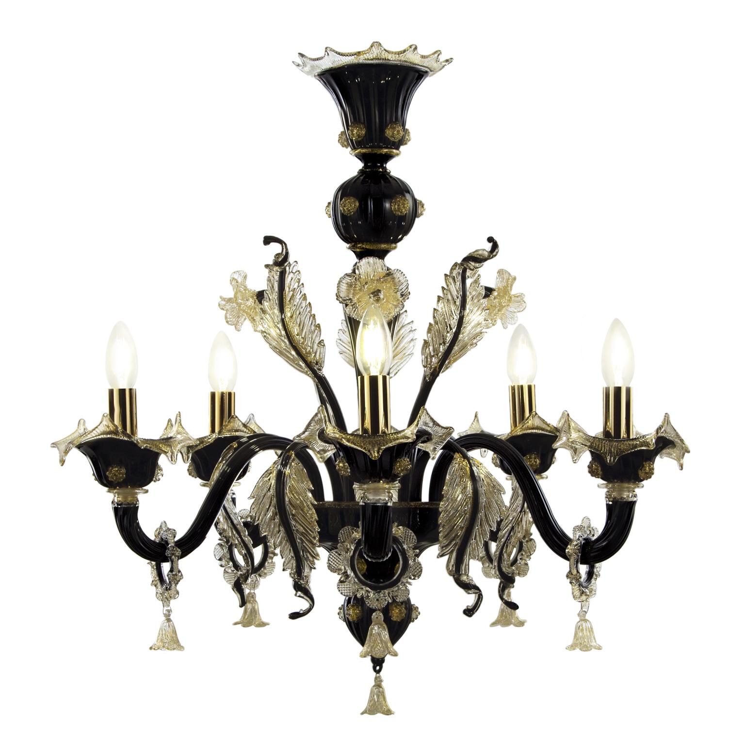 Bovary chandelier, 5 lights, in black artistic glass, with golden details by Multiforme is a luxury chandelier that will never be outmoded.
This collection takes inspiration from the Classic floral Venetian chandeliers, and it is available in many