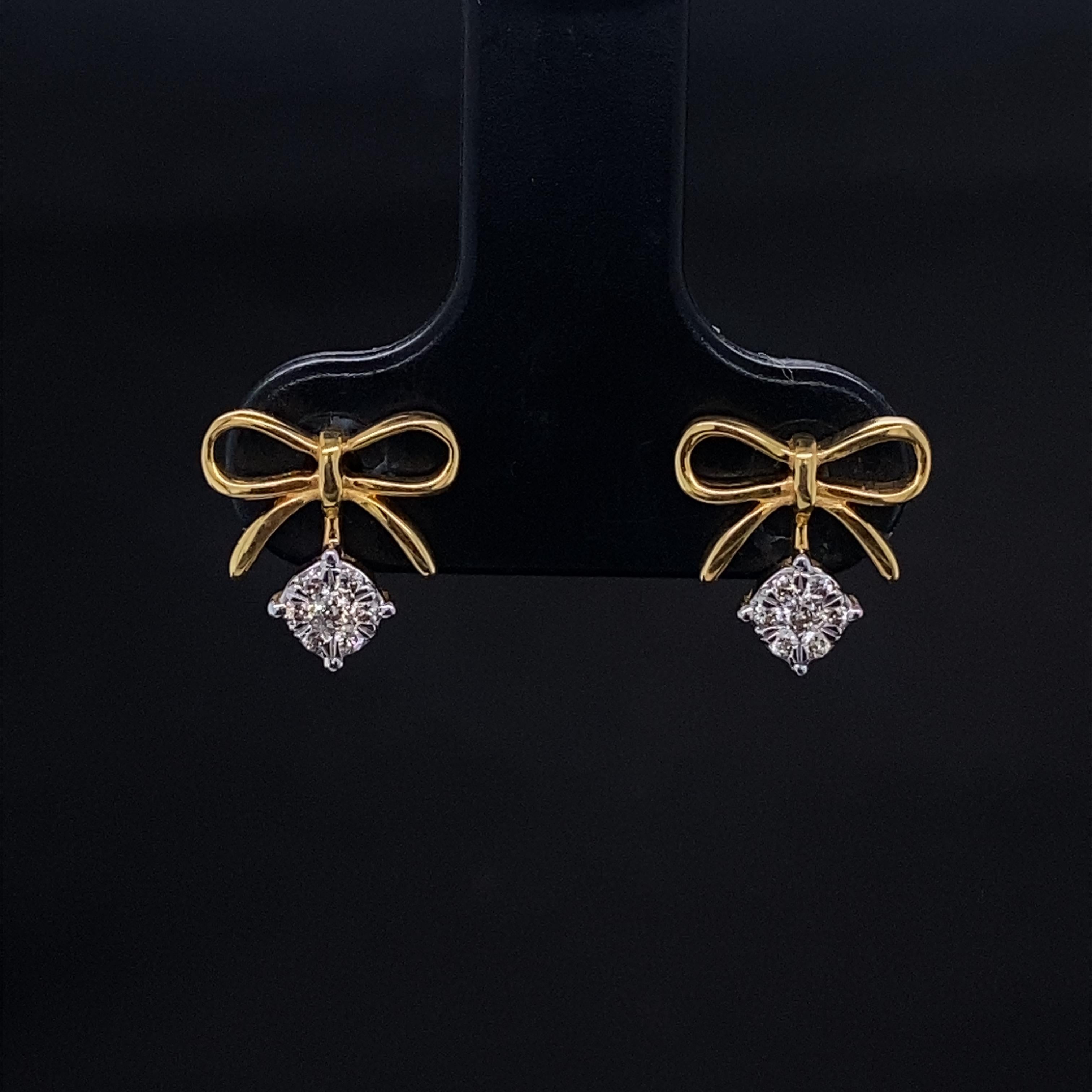 Bow Diamond Earrings for Girls (Kids/Toddlers) in 18K Solid Gold are charming and dainty jewelry pieces designed specifically for young children. These earrings feature a delicate bow design crafted from high-quality 18K solid gold, making them both