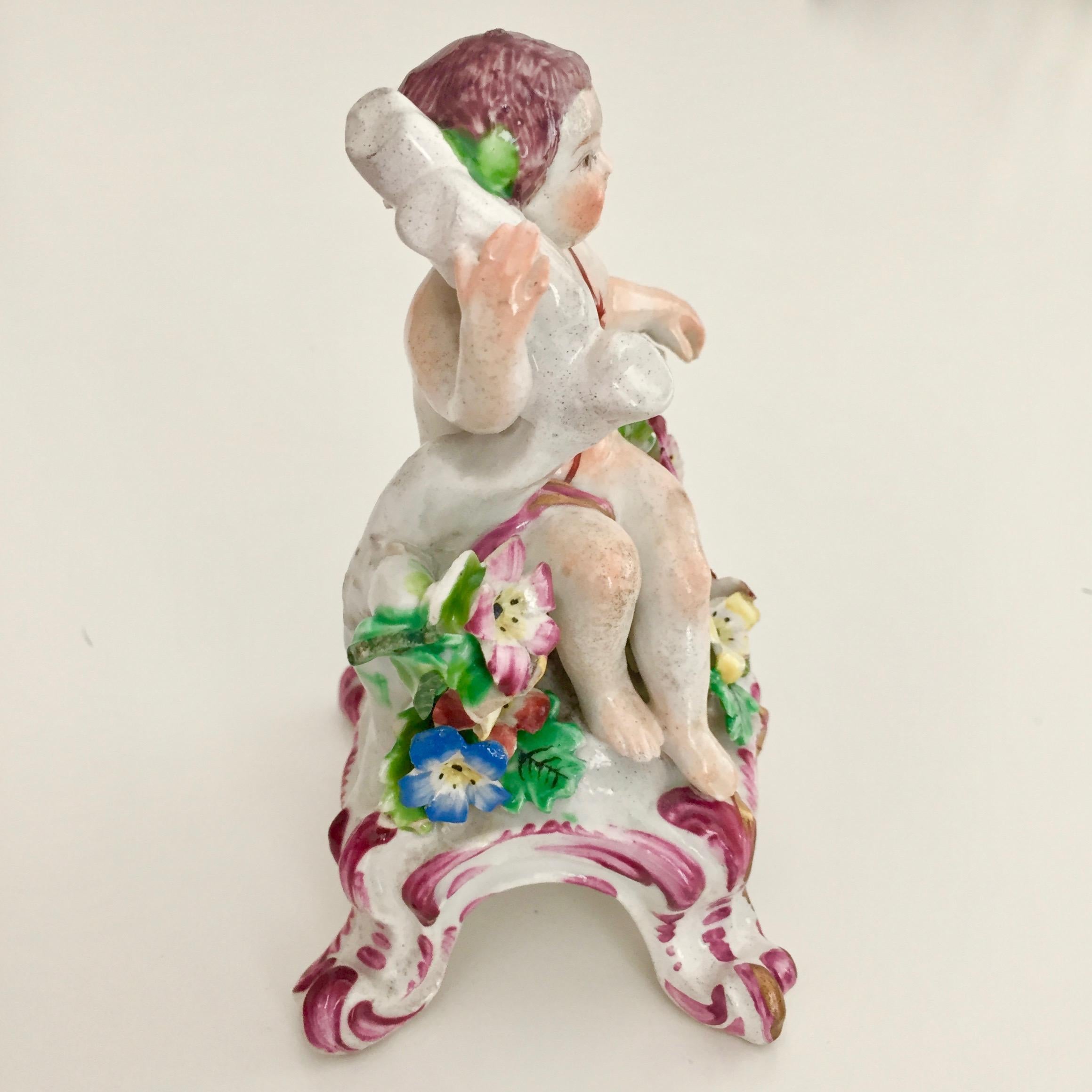 This is a wonderful little figure of a boy or putto made by the Bow Porcelain factory in about 1760.

The Bow Porcelain Factory was one of the first potteries in Britain to make soft paste porcelain, and most probably the very first to use bone ash,