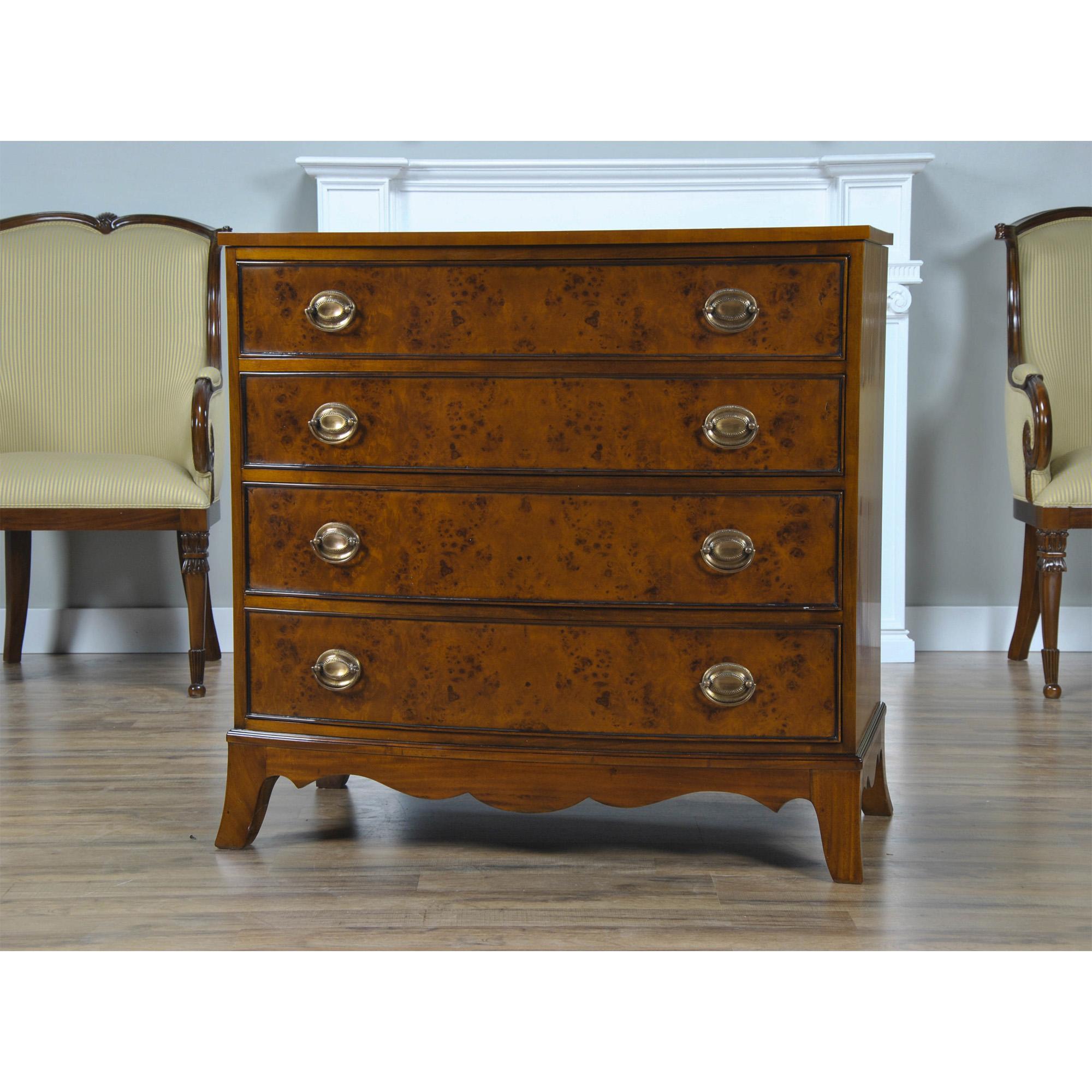 The Bow Front Burled Chest is created using the finest burl wood veneers available. This fine quality Chest is elegant in design while providing a lot of storage space in it’s four graduated drawers. Classic solid brass hardware, a shaped skirt and