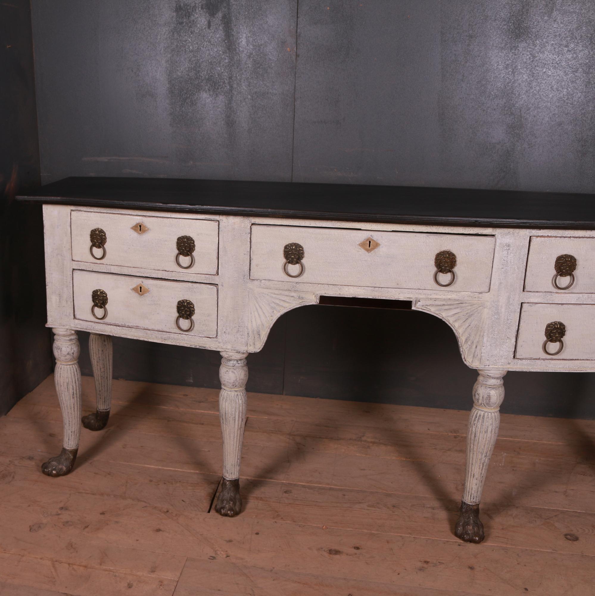 Stunning early 19th century bow fronted sideboard with brass paw feet, 1820.

Dimensions:
76.5 inches (194 cms) wide
20 inches (51 cms) deep
35.5 inches (90 cms) high.