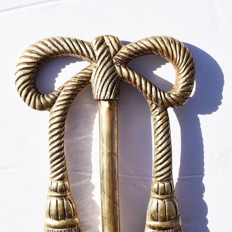 brass bow candle sconces