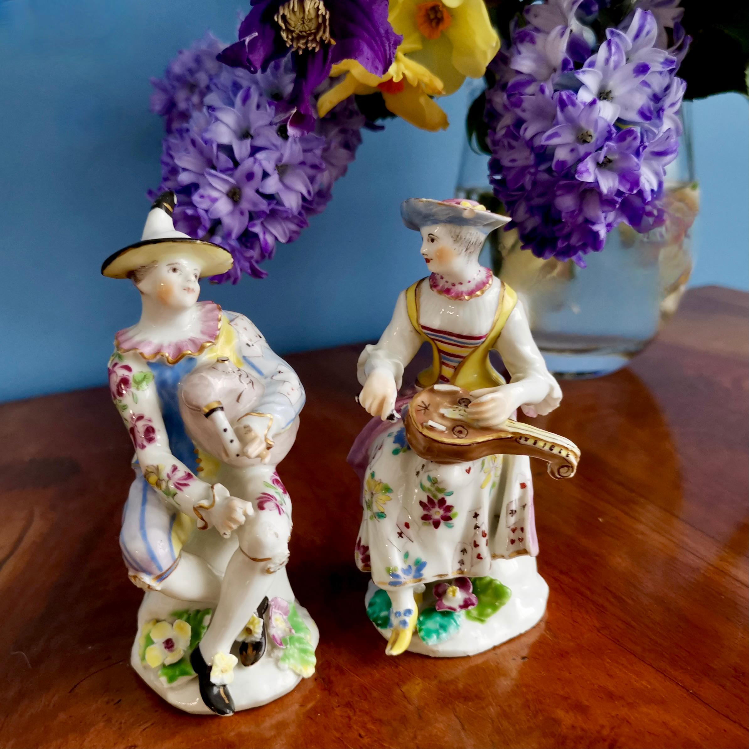 This is a wonderful pair of figures of Arlecchino and Columbina, made by the Bow Porcelain factory in about 1758. These figures formed part of a series of the Commedia dell'Arte, a very popular series of theatrical figures that served as decoration