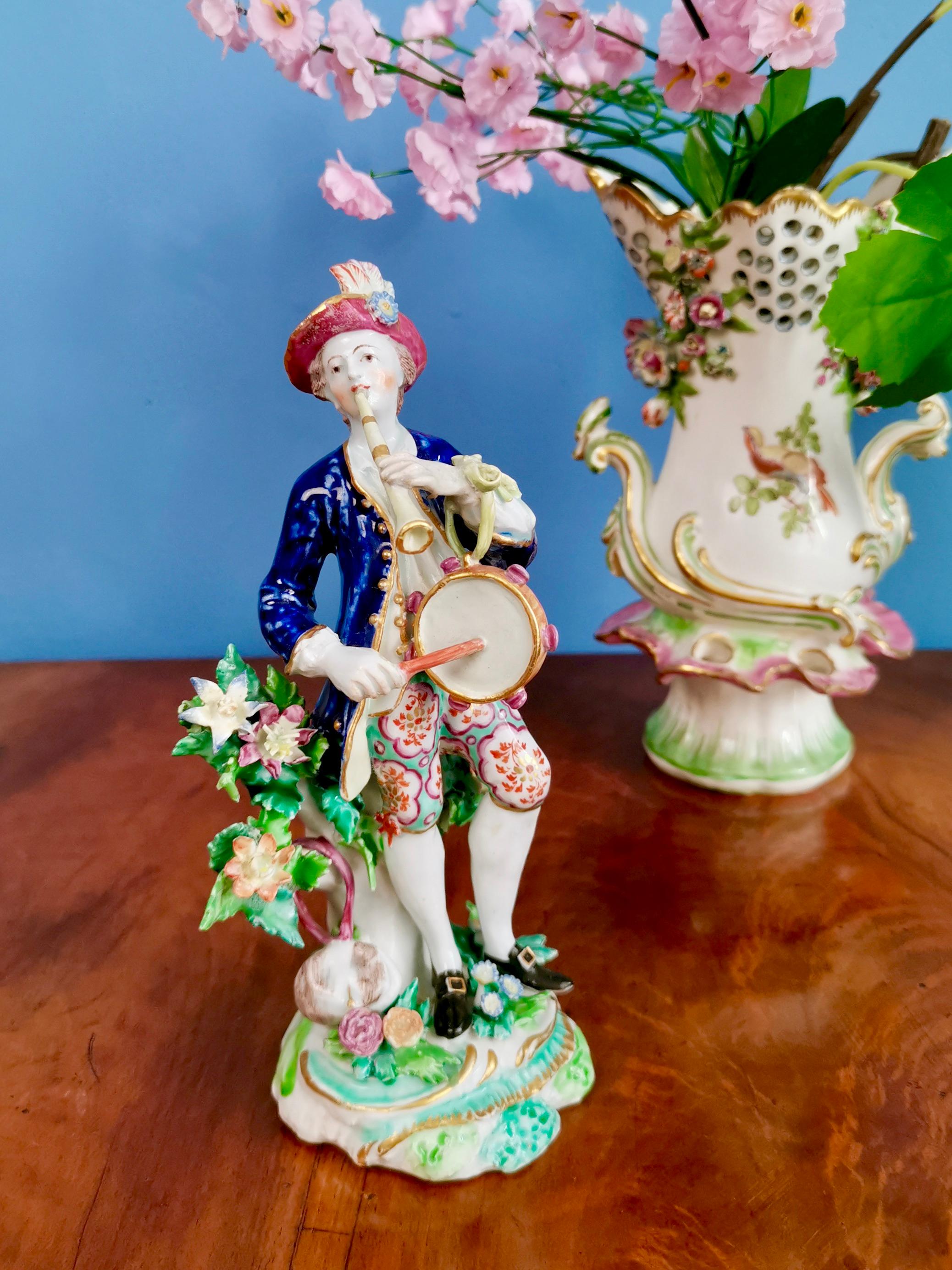 This is a wonderful figure of a musician made by the Bow Porcelain factory in circa 1760.

The Bow Porcelain Factory was one of the first potteries in Britain to make soft paste porcelain, and most probably the very first to use bone ash, which