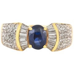 Bow Tie Style with Center Sapphire and Diamonds Around Ring