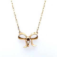 Bow tie vintage pendant necklace yellow gold