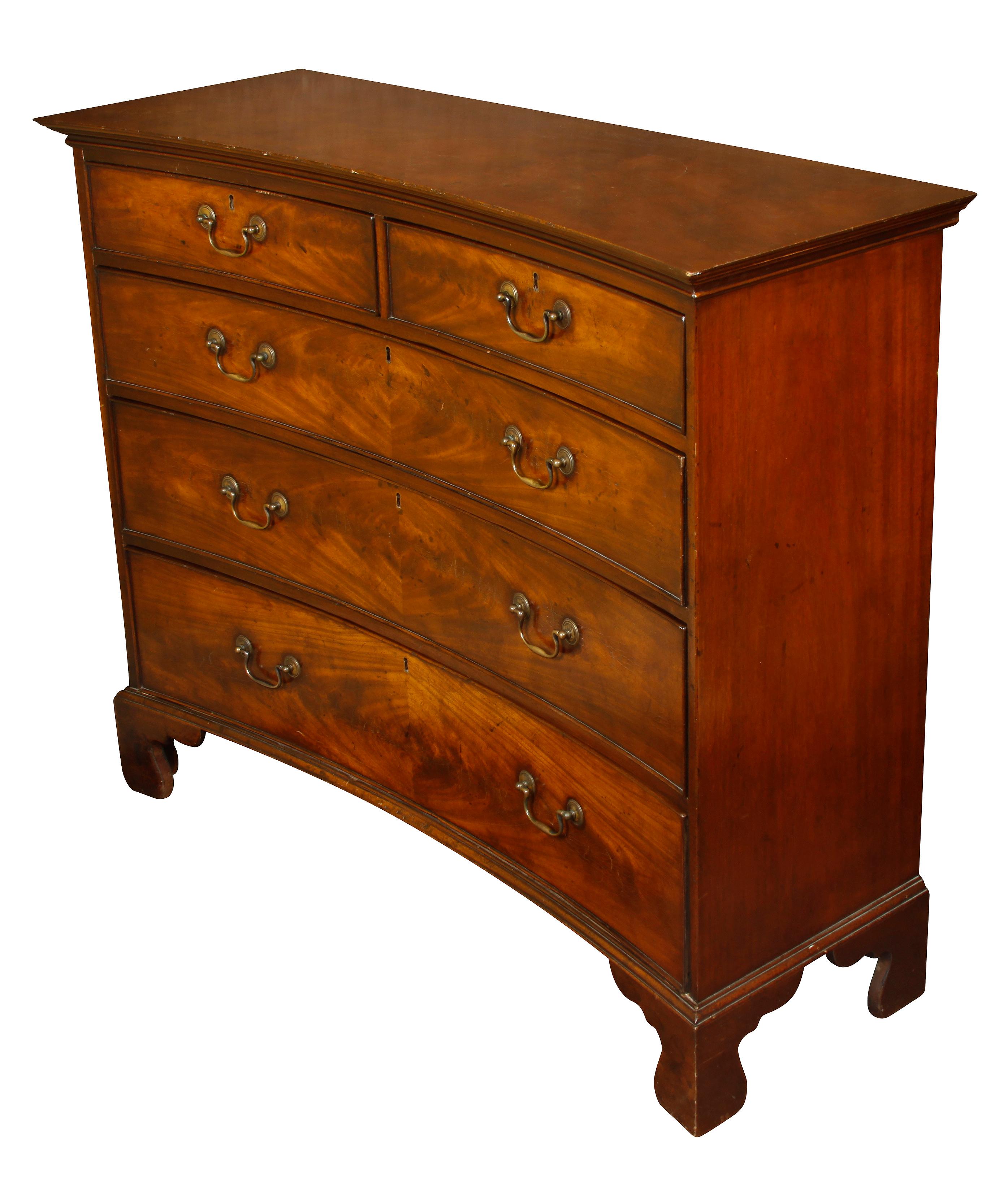 Bowed English mahogany chest of drawers. Two drawers at top and three below, all with curved bail drawer pulls.