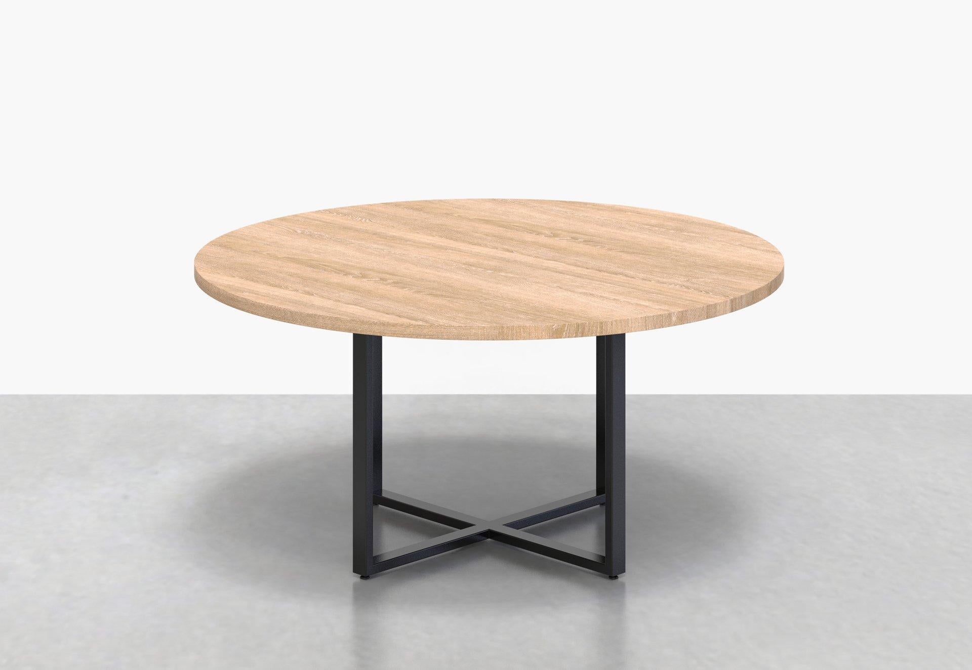 Paired back with Classic proportions, our Bowen round table adds subtle class to any space. The Bowen's steel base supports a thick wood top, and makes for the perfect gathering point.