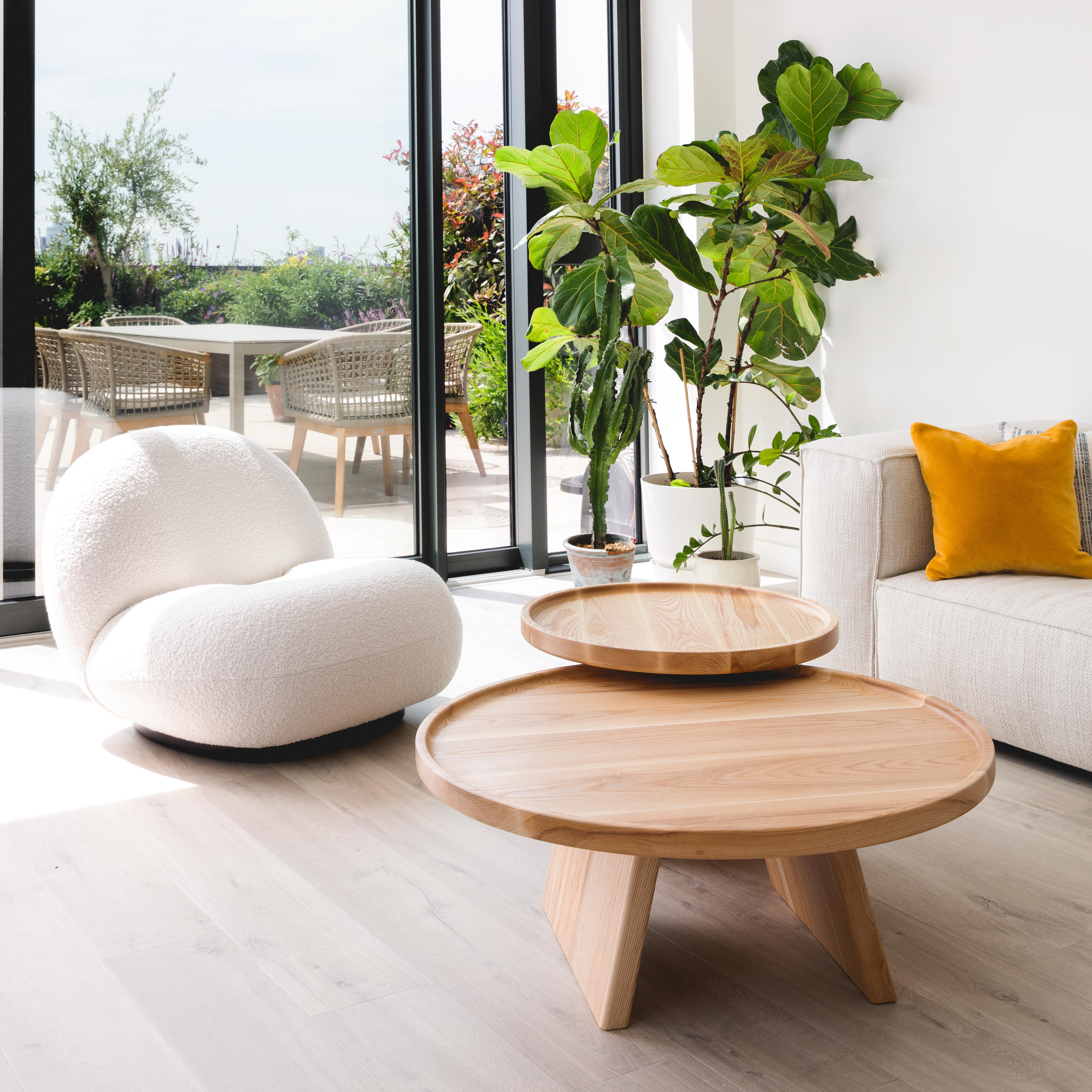 This contemporary coffee table pair celebrates elevated simplicity.

The tables are designed to interact with one another, seamlessly nested together in a delightful two-tiered pair, or used as separate pieces, bringing spontaneity to your living