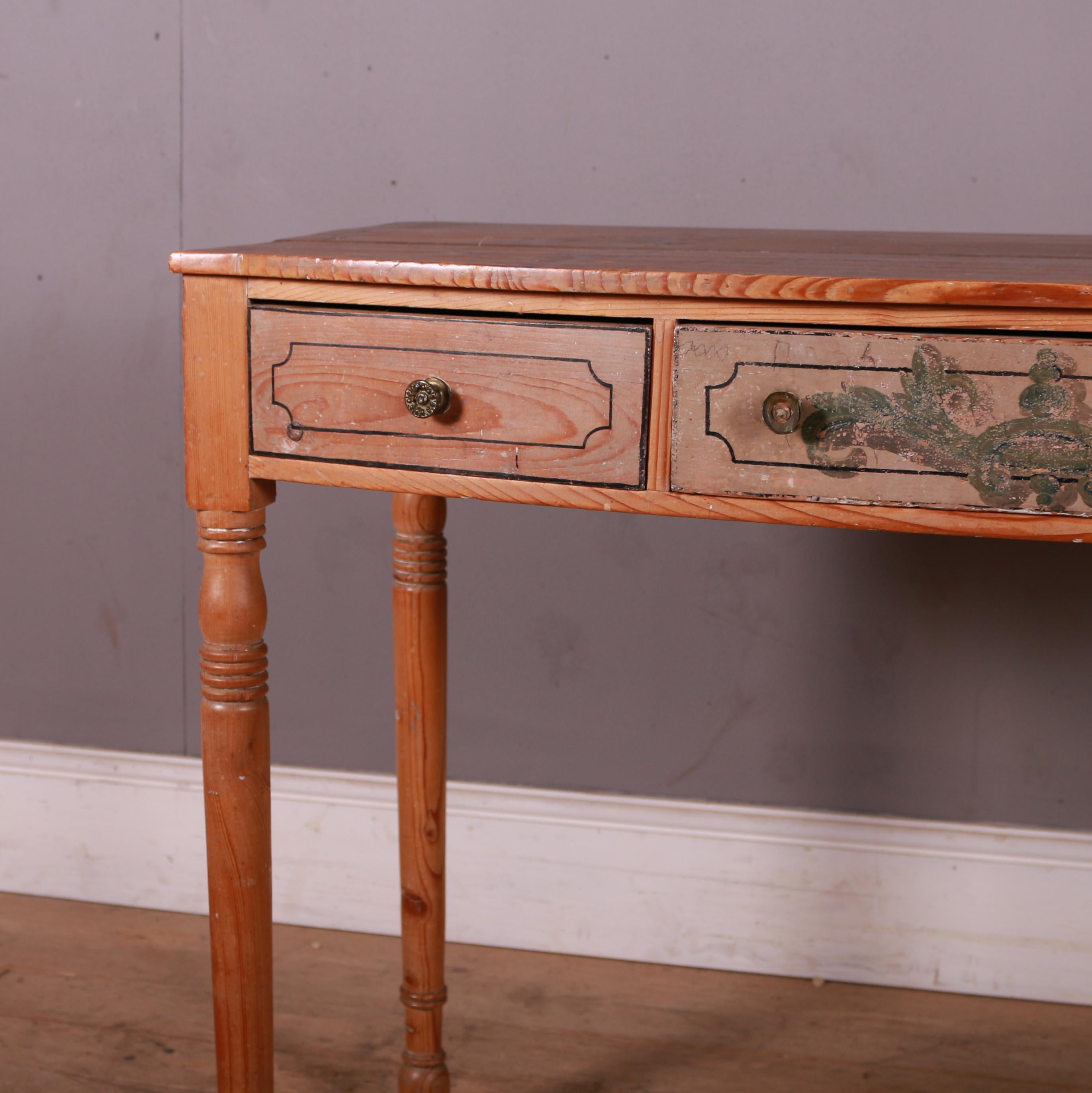 Early 19th C bowfronted pine lamp table / desk with traces of original paint. 1820.

Clearance is 24.5