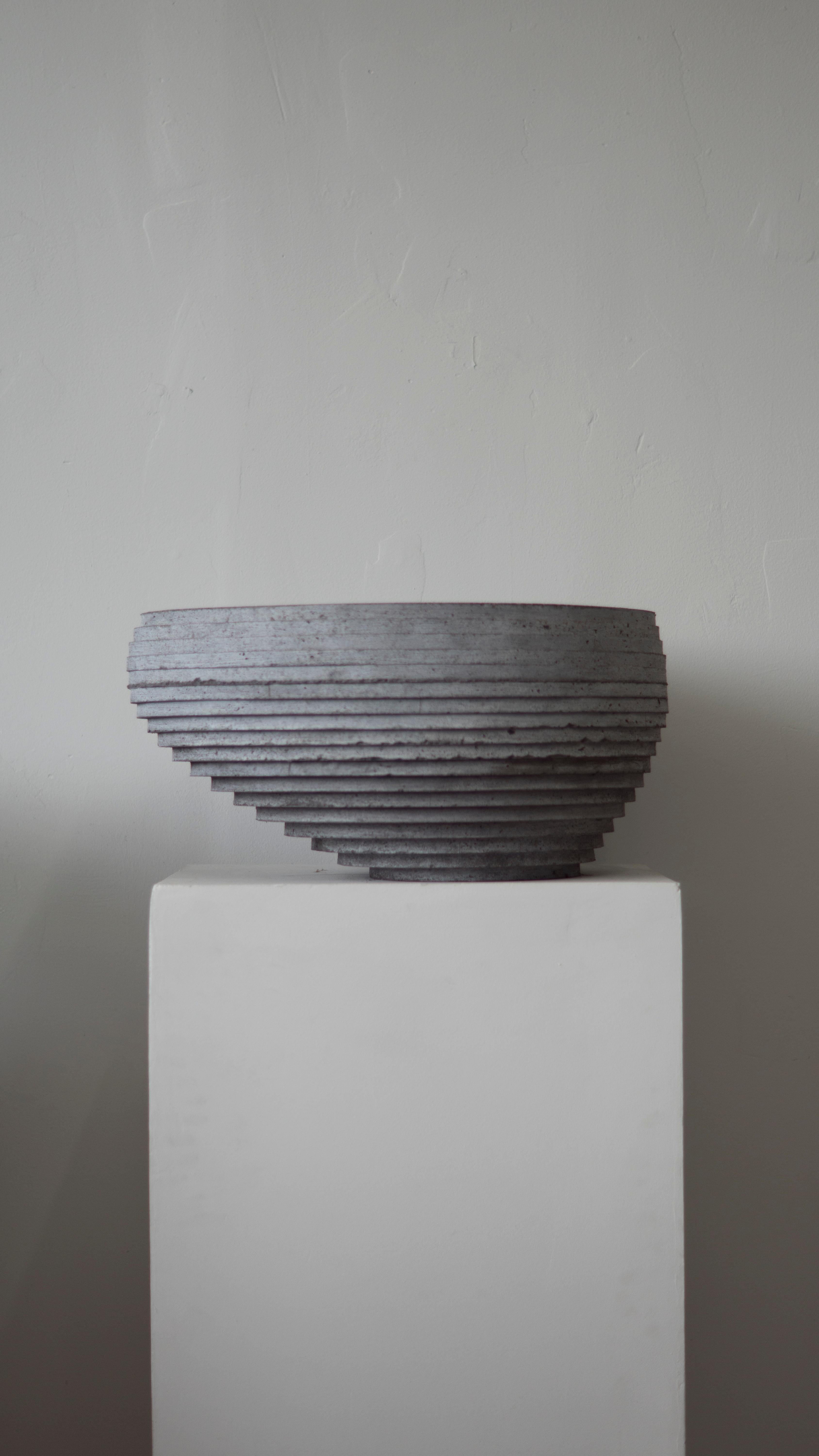 Hand-cast bowl for indoor and outdoor use. Can be used for planting as well; drainage holes can be added.

At the intersection of art, craft, and design, Concrete Poetics' debut collection of hand-cast cement sculptural furniture and accessories