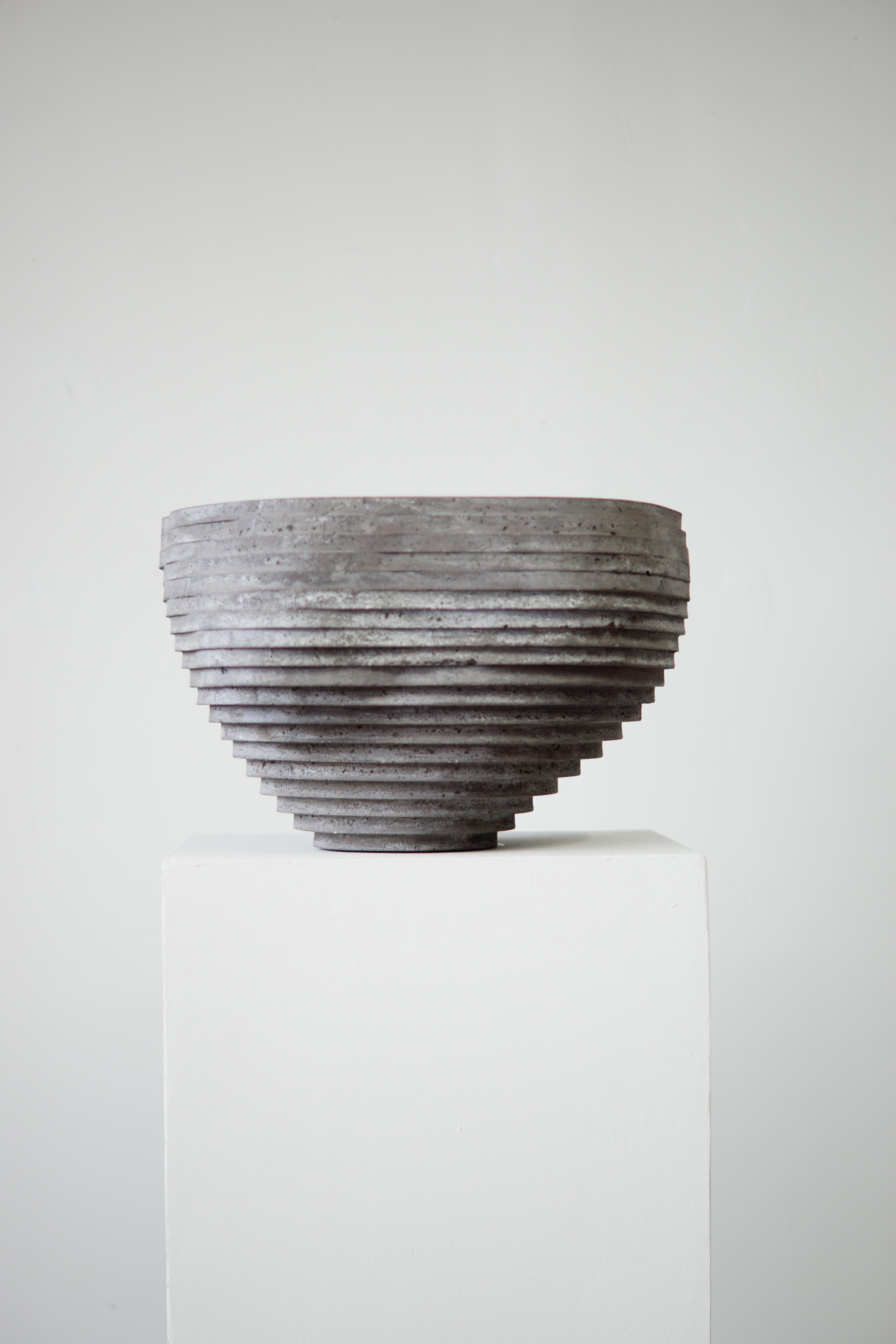 Large hand-cast bowl for indoor and outdoor use. Drainage holes can be added upon request.

At the intersection of art, craft, and design, Concrete Poetics' debut collection of hand-cast cement sculptural furniture and accessories streamlines
