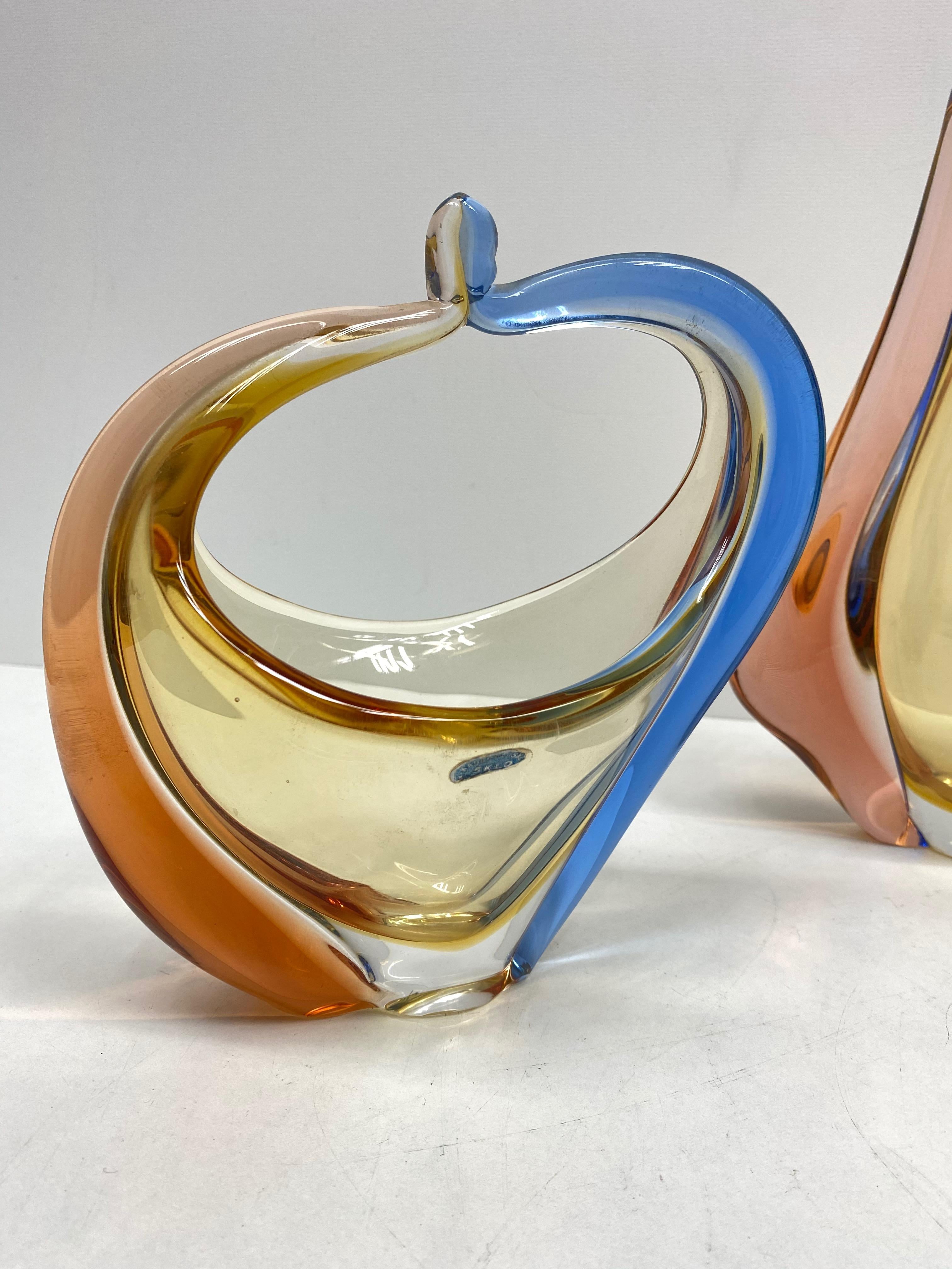An amazing art glass bowl, basket object and a vase, in an unusual design and a pretty beautiful blue, amber and brown color. Three highly decorative pieces useful as centre pieces. Bohemian Czech glass by Hana Machovska Romana for Sklo Mstisov
