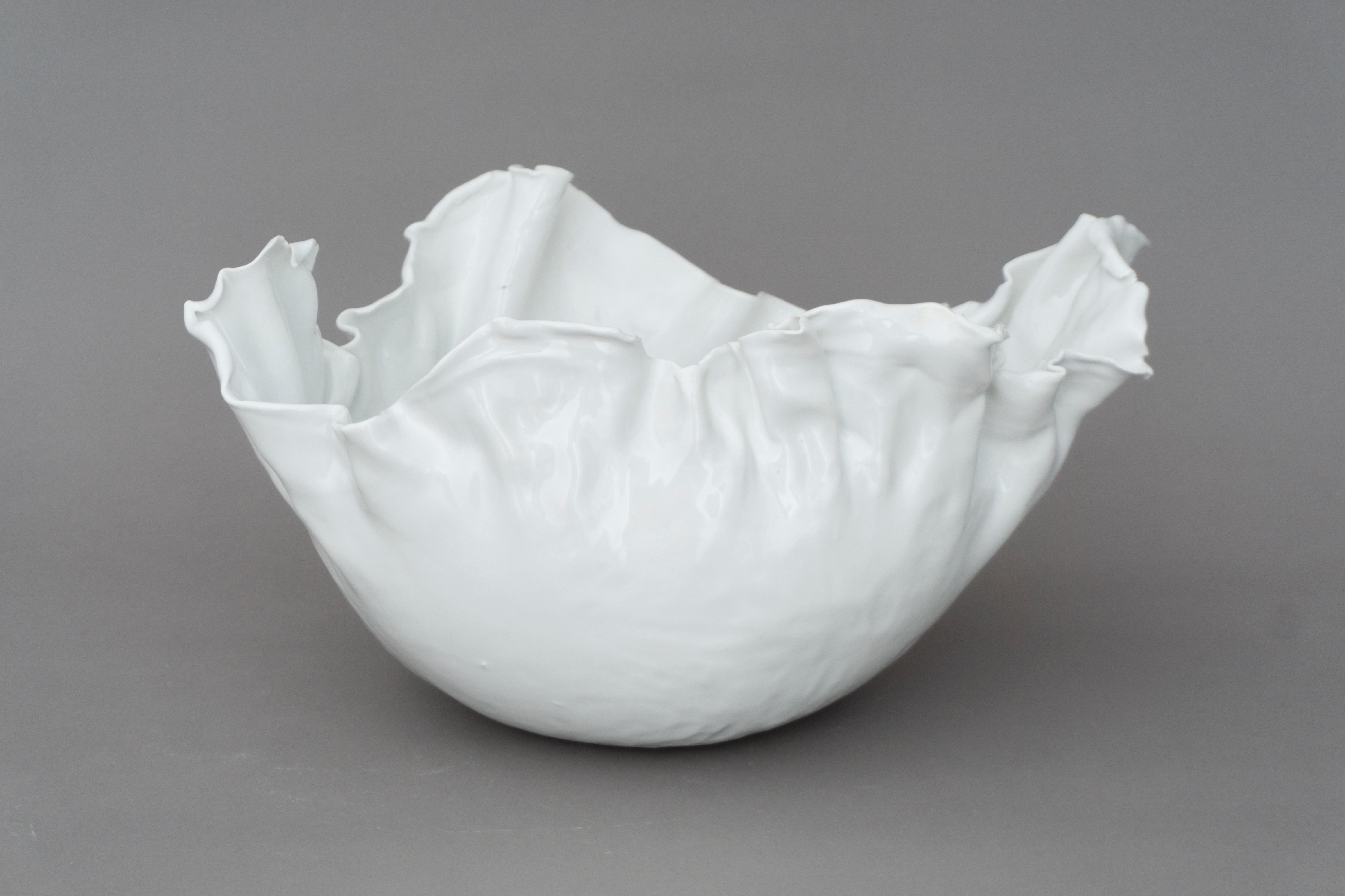 Unique porcelain bowl with a white glazing, a simple and elegant form. Made by Danish designer Christine Roland. 
A second version is available. 

'Christine Roland is a Berlin-based ceramicist, creating unique works of stoneware and