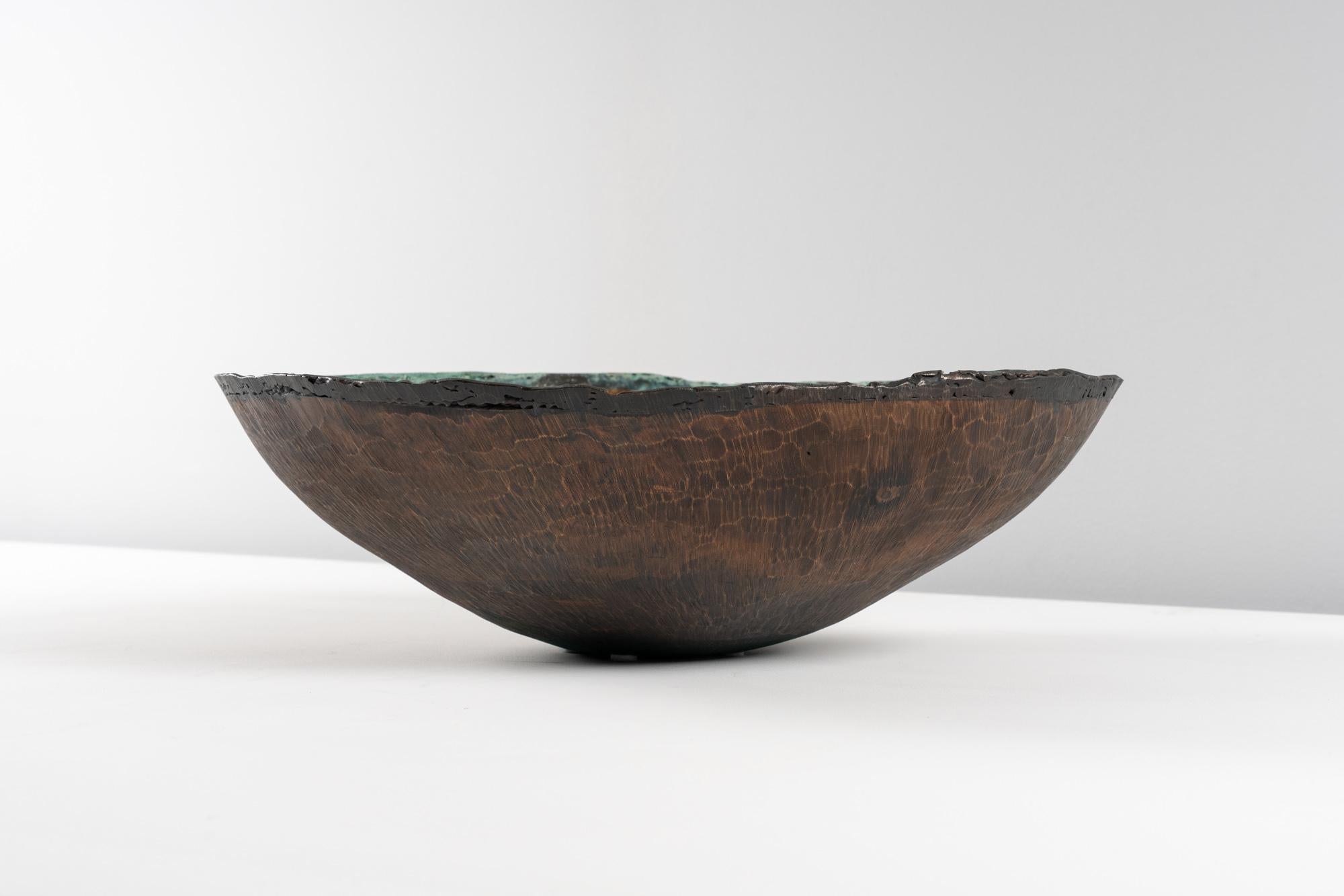 This extraordinary bowl was created by Lorenzo Burchiellaro (1933–2017), an Italian designer and sculptor who preferred to work with all kinds of metals.
The bowl is hammered and hand-milled from cast copper.
Manufactured by Studio Burchiellaro.
It