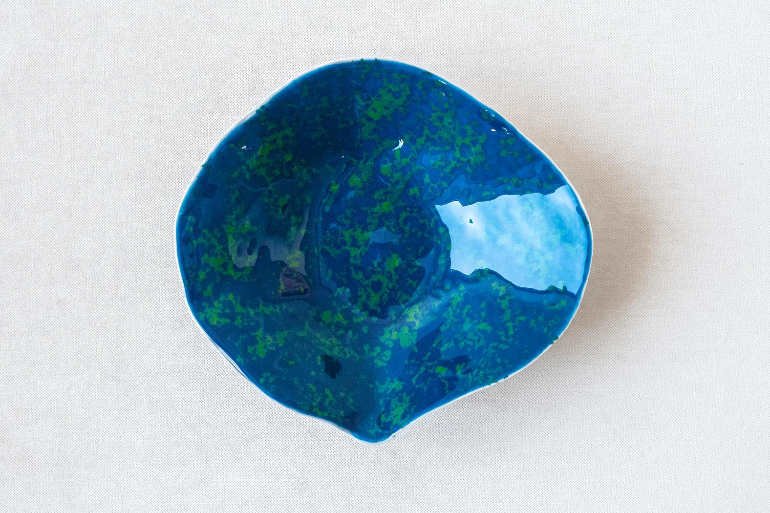 • Medium bowl
• Measures: 18cm x 17cm x 5cm 
• Perfect for a starter soup, dessert or side dish
• Hand painted deep blue glaze with green variations
• Richly textured unglazed bottom
• Designed in Amsterdam / handmade in France
• True