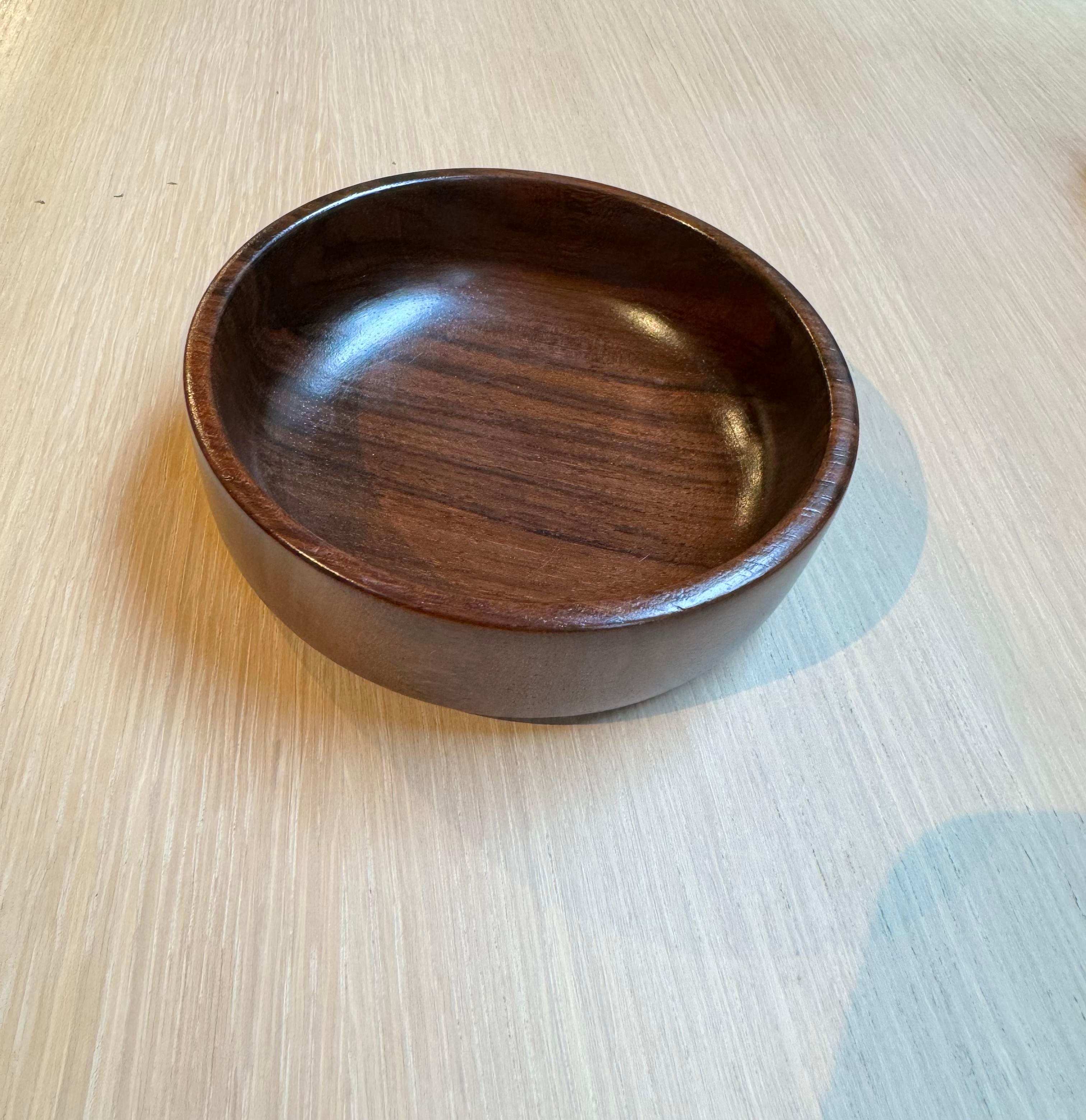 This Brazilian mid century modern bowl, designed by Tropic Art, is absolutely stunning.  Handcrafted with hard rosewood (also known as jacaranda), this bowl has a deep, dark, and rich tone with a stunning natural wood grain. In addition, the wood