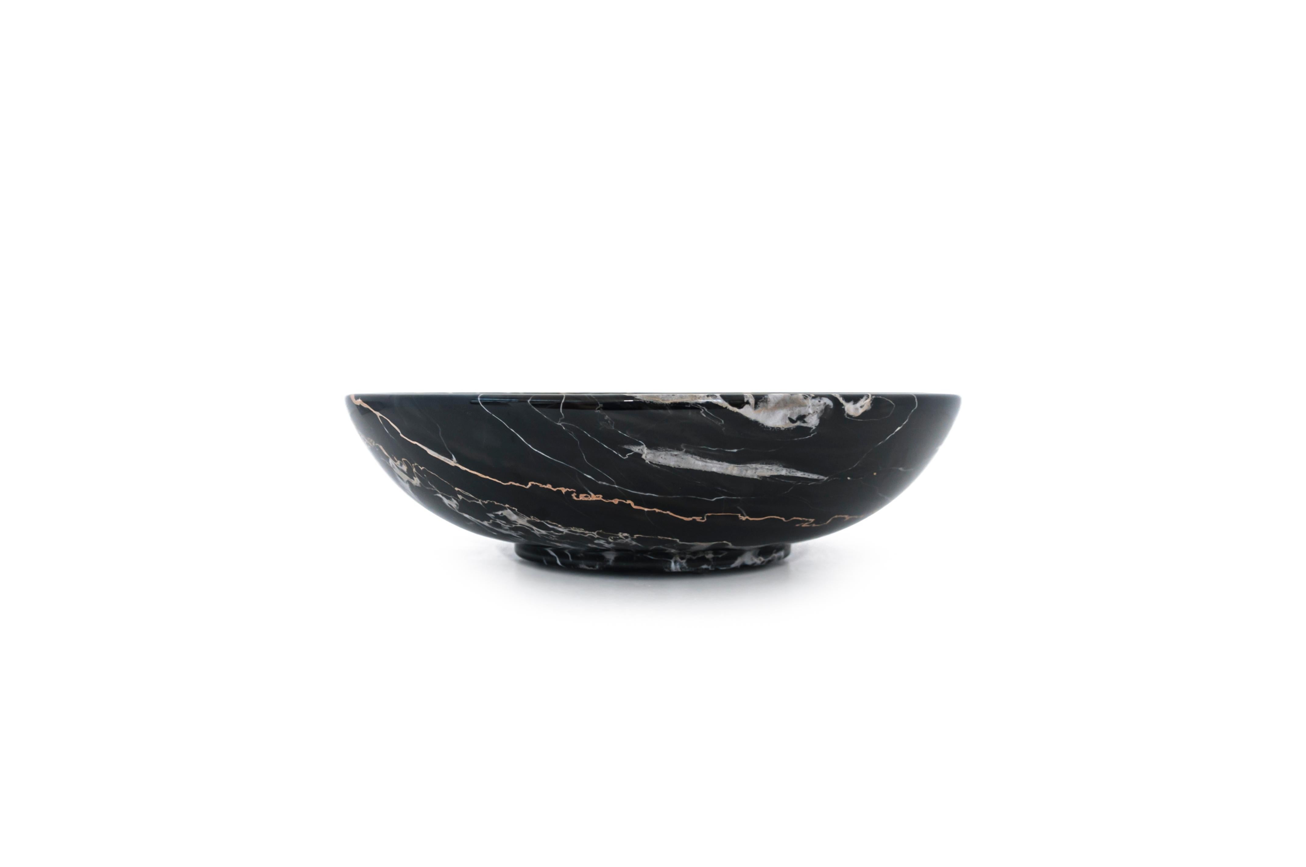 Big fruit bowl in Portoro marble, characterised by a dark black background with golden veins. Processed in Carrara, Italy. You have a 100% made in Italy product.
It is ideal to present fruit or to be used as a centrepiece.
Each piece is in a way