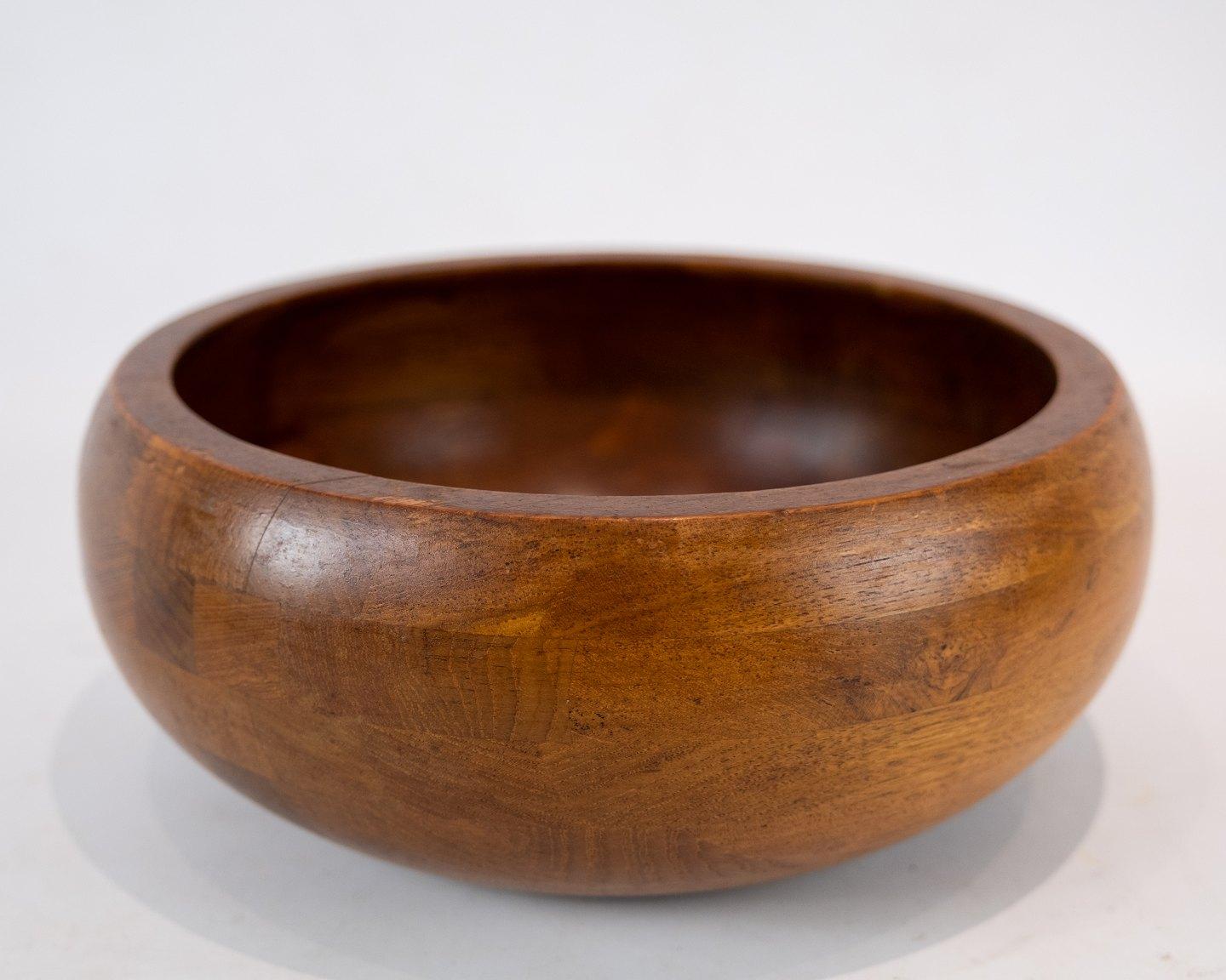 
 
This teak bowl, designed by Jens Harald Quistgaard in the 1960s, is a stunning example of mid-century Danish design.

Crafted from rich teak wood, the bowl exudes warmth and natural beauty, adding a touch of organic elegance to any space. Its