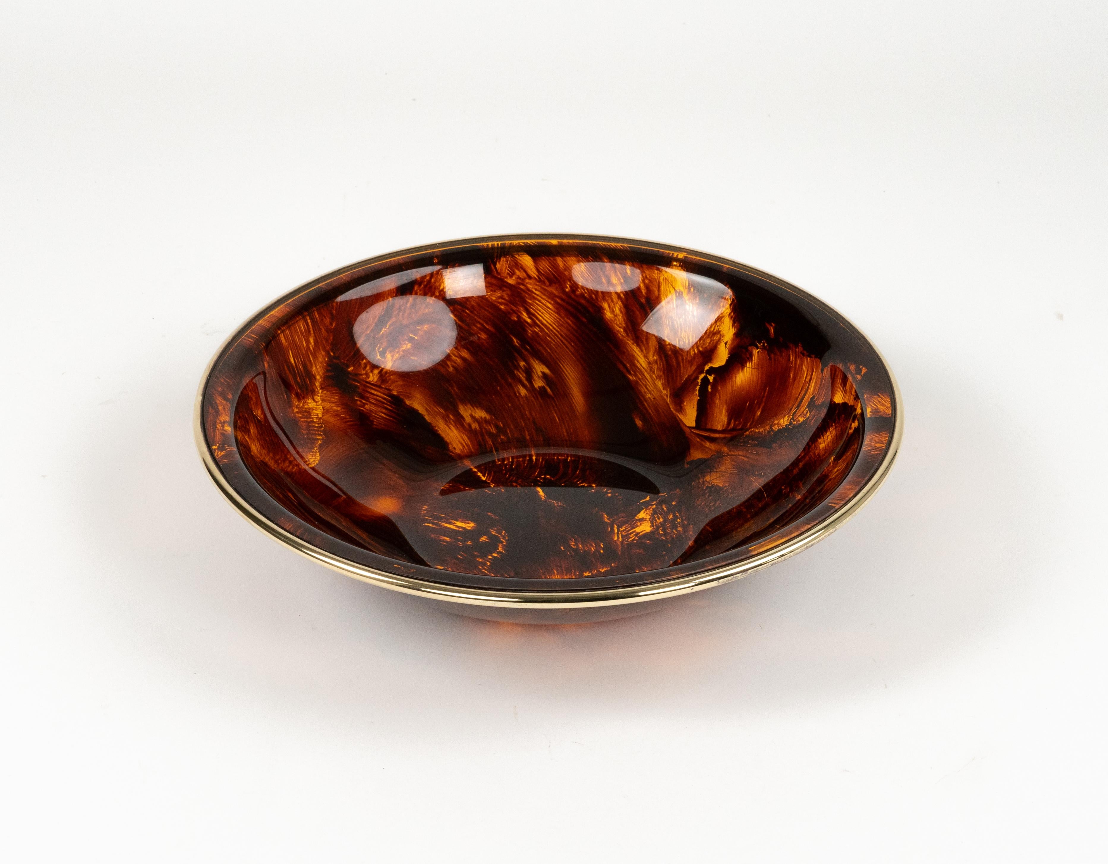 Midcentury amazing round bowl in in lucite tortoiseshell effect and brass in the style of Christian Dior Home.  

Made in Italy in the 1970s.