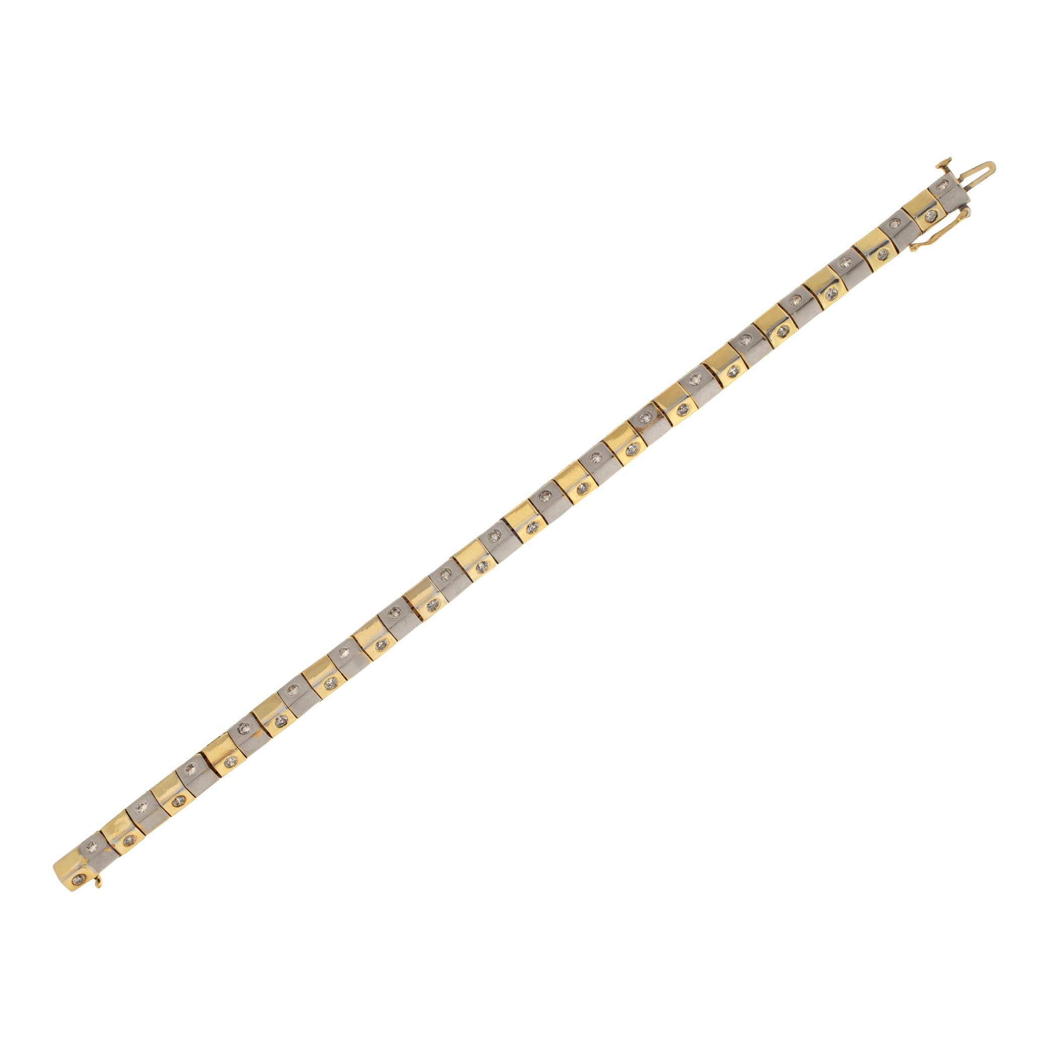 Box link bracelet in 18k white & yellow gold with approximately 1 carat in round diamonds. 7.25in in length.