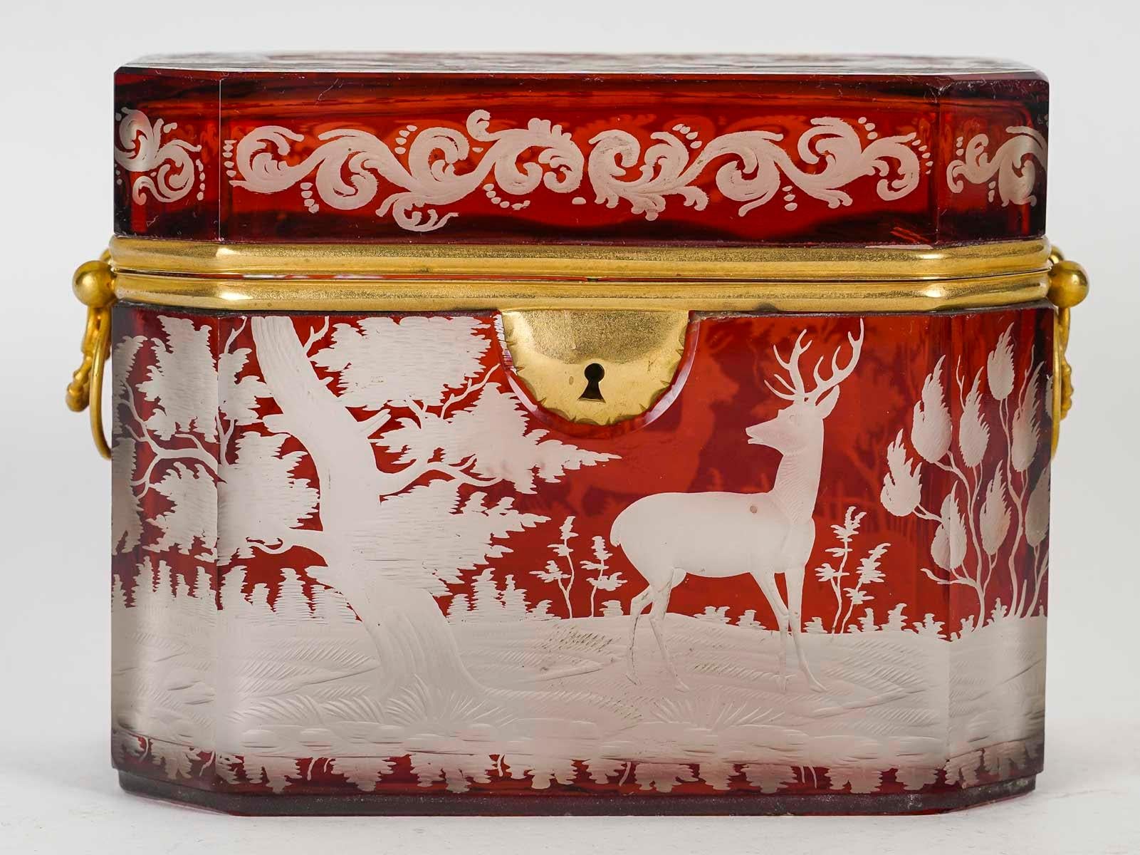 Box, Bohemian crystal box, 19th century, Napoleon III period.

Bohemian crystal box, brass mounting, double handle, 19th century, Napoleon III period.
h: 11.5cm, w: 15cm, d: 9cm
