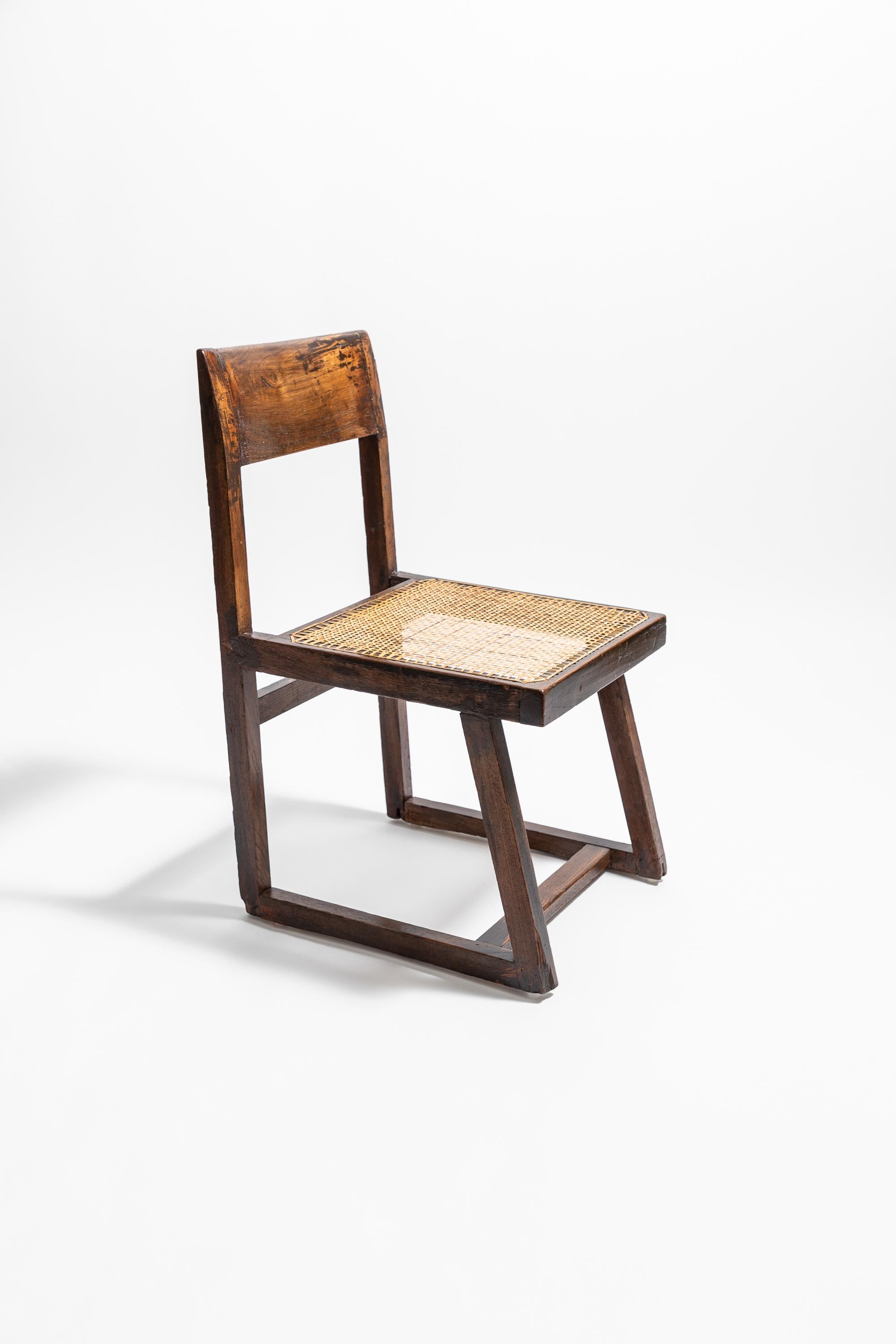 Authentic Chandigarh 'Box' chair in teak, circa 1960. PJ-SI-54-A.

Made in richly coloured teak, lightly restored and re-caned to retain as much of the chair’s original patina as possible. Old knocks, marks and splits have been secured and