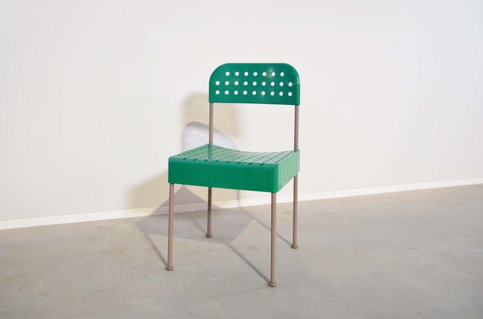 The Box chair is a good example of a rational design, the components can be easily dismantled and packed into a flat box as big as the seating of the chair. This chair comes in a fresh green color and is marked under the seating.