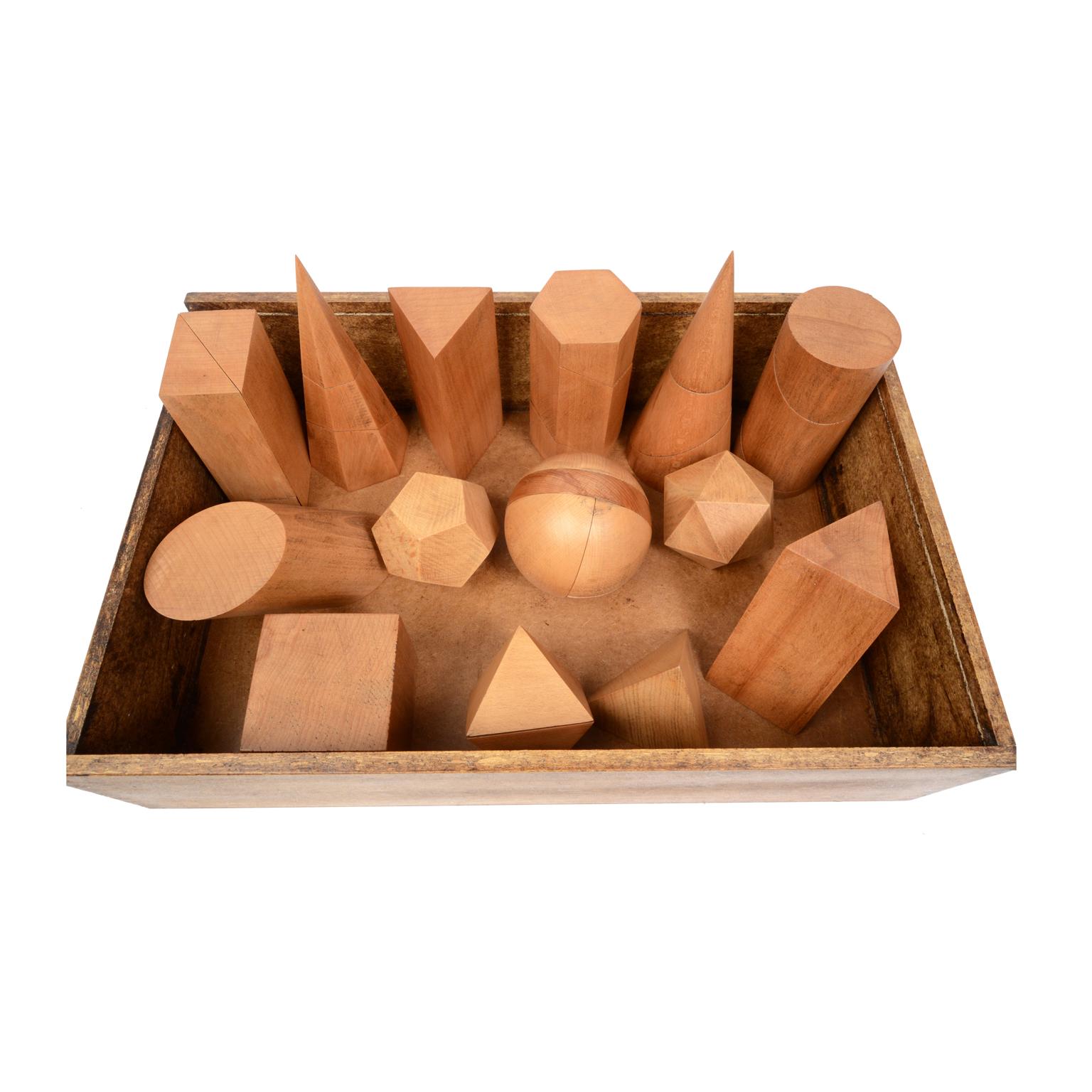 Box containing 14 dismounplate geometric solids of oak wood, height 20 cm, in their original wooden box complete with illustrative leaflet for calculating surfaces and volumes. Made for educational purposes for schools by Antonio Vallardi publisher