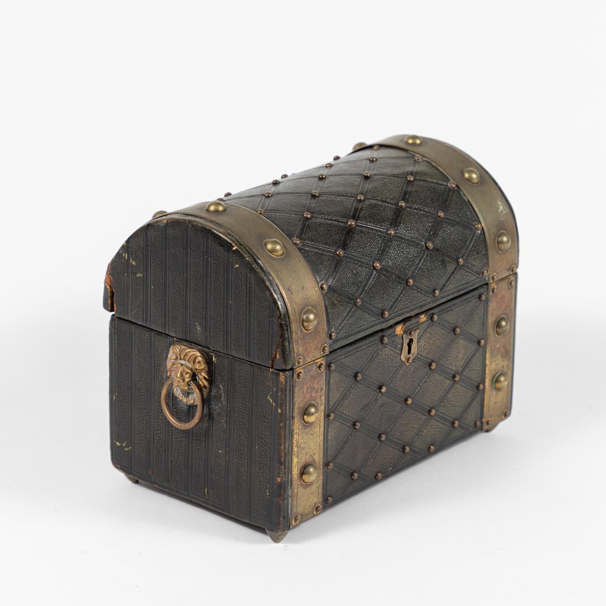 A brass studded leather box.
 