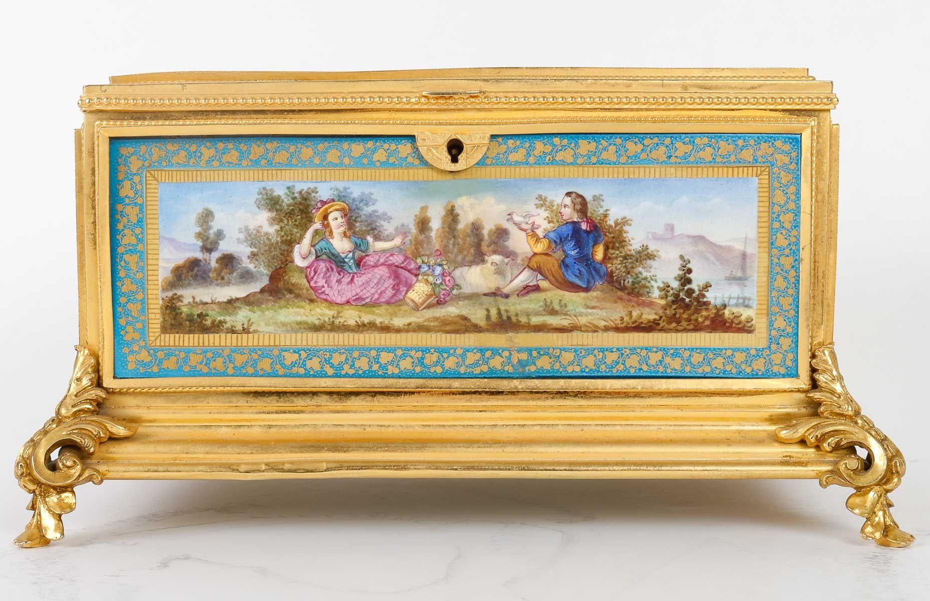 Box, Gilt Bronze and Porcelain Plates, 19th Century.

Box, gilt bronze box and painted and gilt porcelain plates, blue cloth interior, 19th century, Napoleon III period, key missing.

H: 14cm, W: 24cm, D: 16cm
