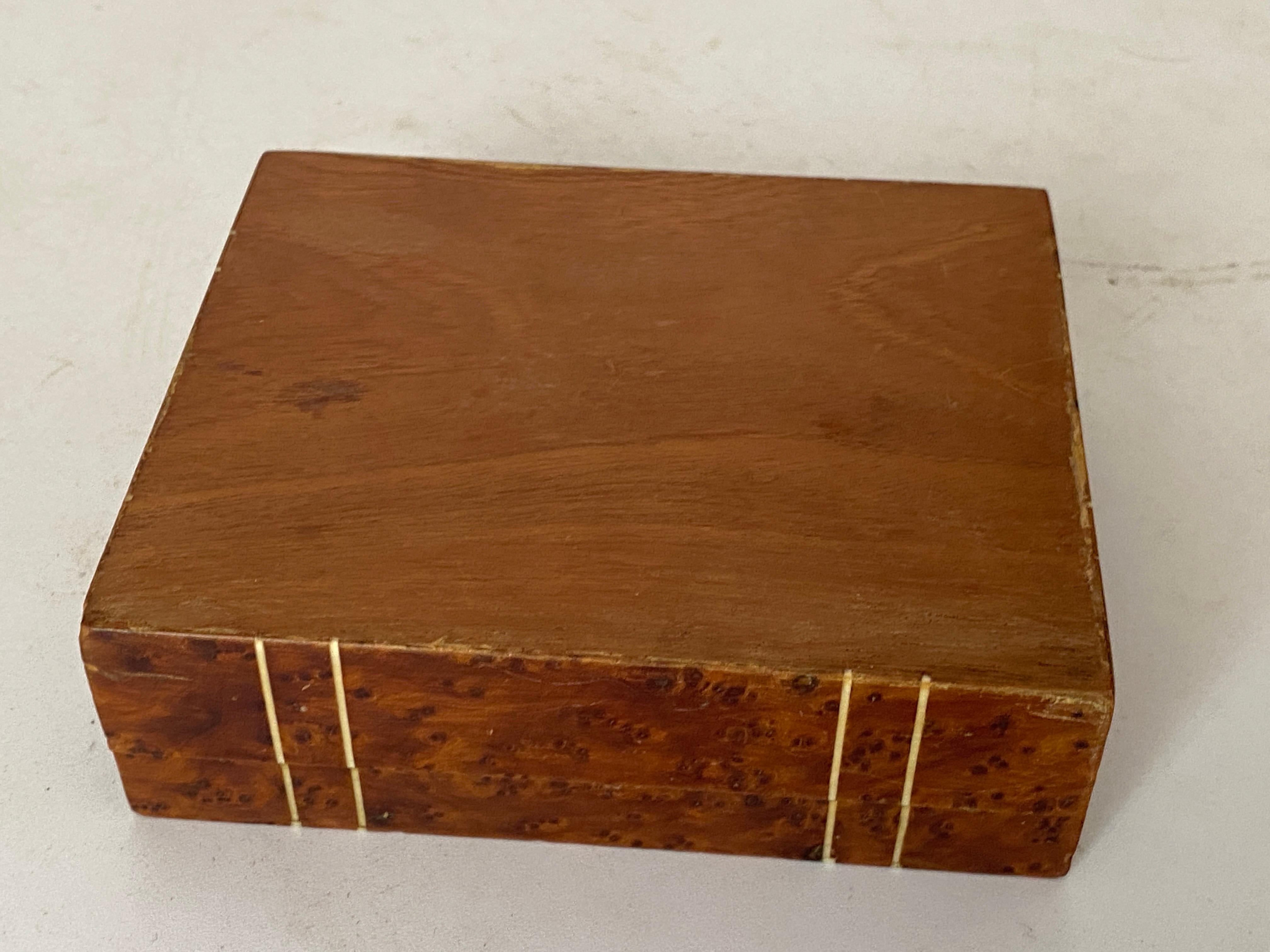 This box is in burl wood. It has been made in France in the 1870s. The color is brown, and it is in an good condition. 
Brown color.