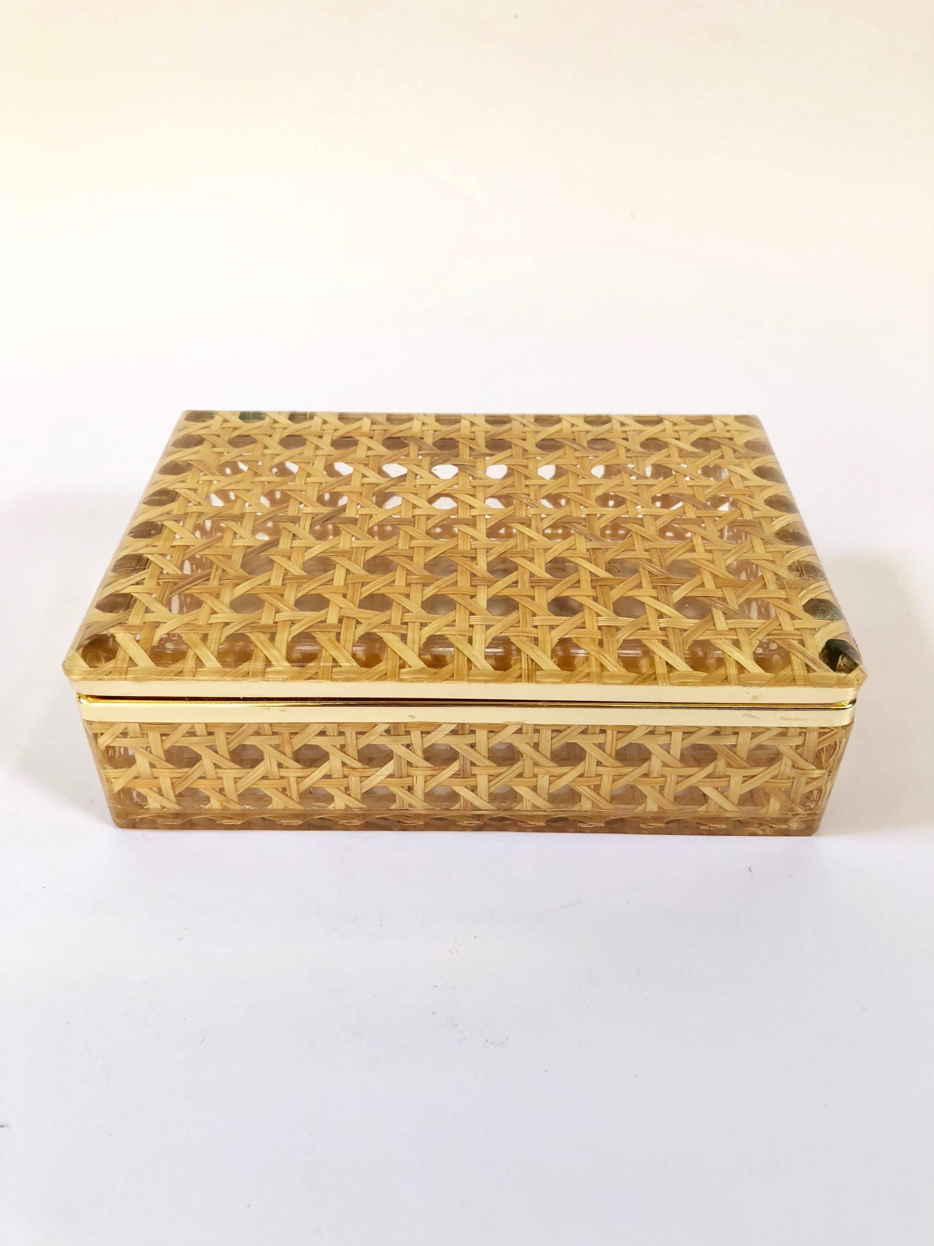 Amazing and useful box in Lucite embellished in plasticized wicker.