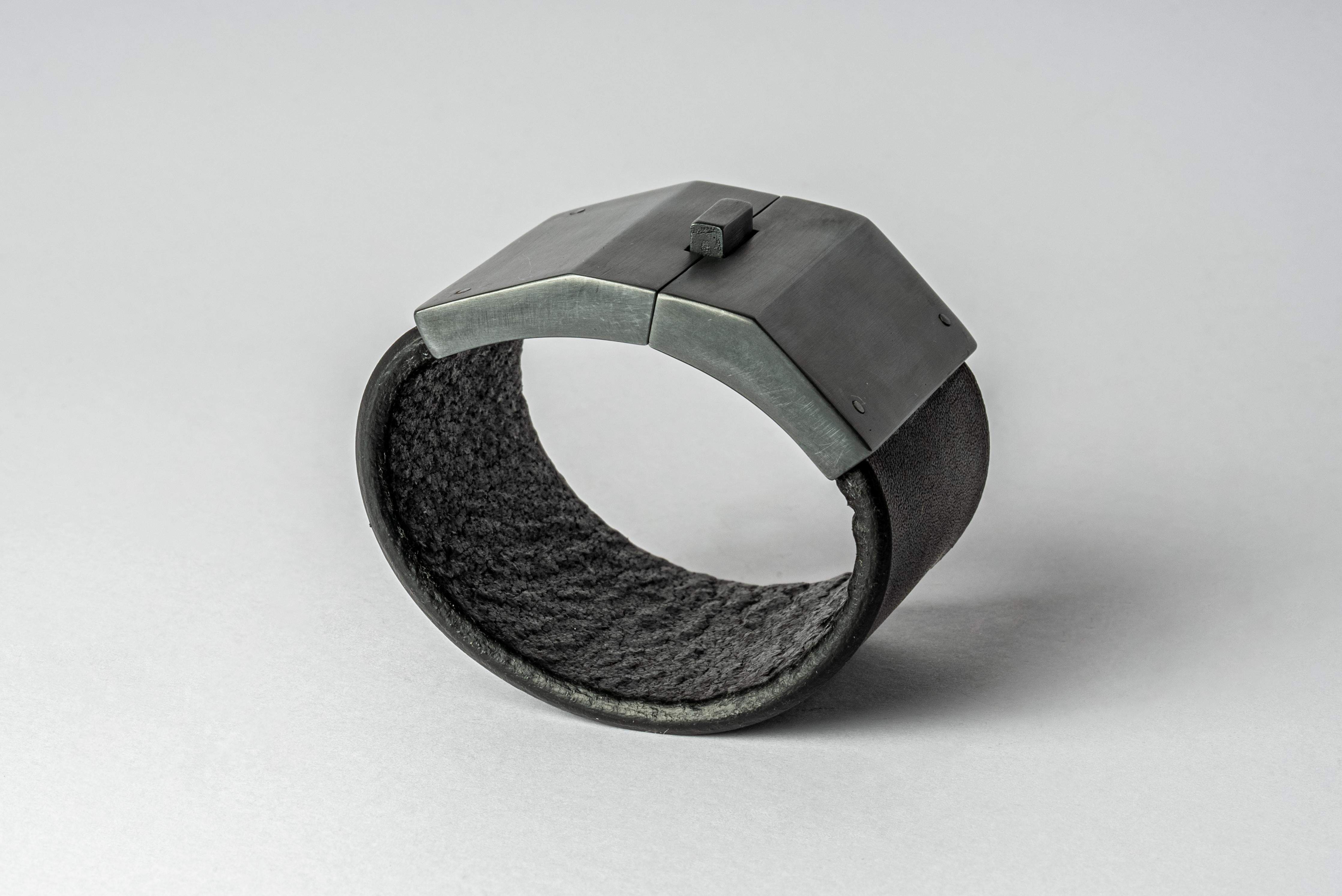 Bracelet in black buffalo leather and black sterling. Black sterling is a surface oxidation of sterling silver. This finish may fade over time, which can be considered an enhancement.