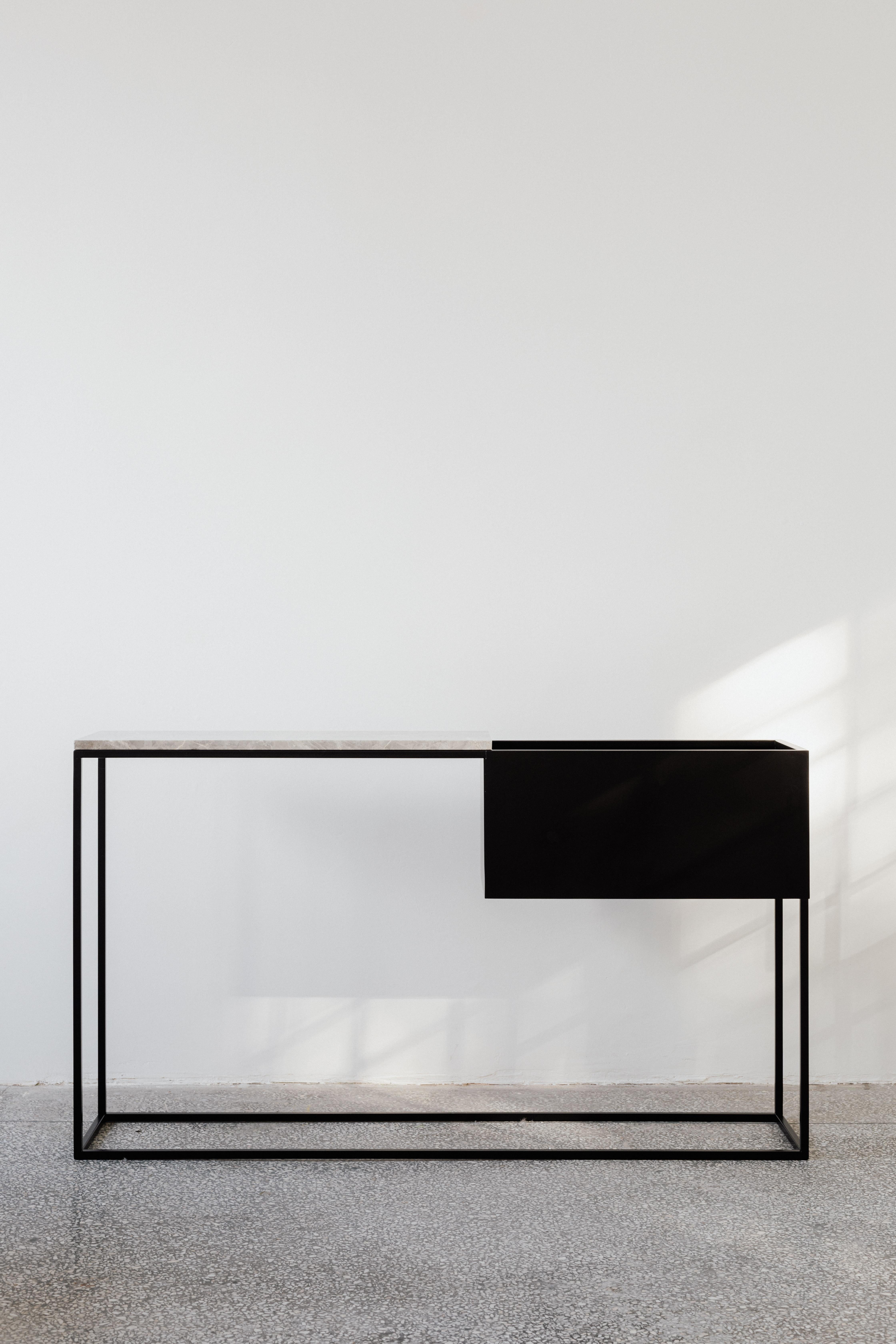 Box Maxi L Grey Console Table by Un’common
Designed by Małgorzata Korycka.
Dimensions: D 28 x W 160 x H 80 cm.
Materials: Steel and Fior di Bosco marble.

Available in different marble options. Please contact us.

BOX MAXI is a fine example of