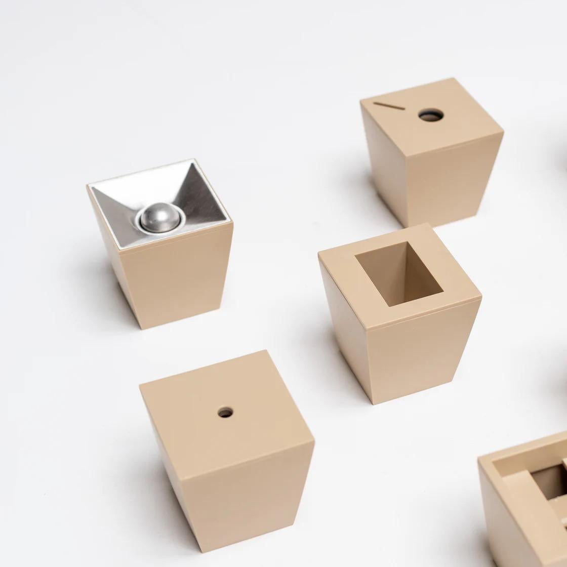 A rare and collectible desk set designed by Ghion, composed of modular plastic elements that reinterpret the aesthetics of office organization with sculptural precision. Each piece — from pen holder to tray — combines functionality with