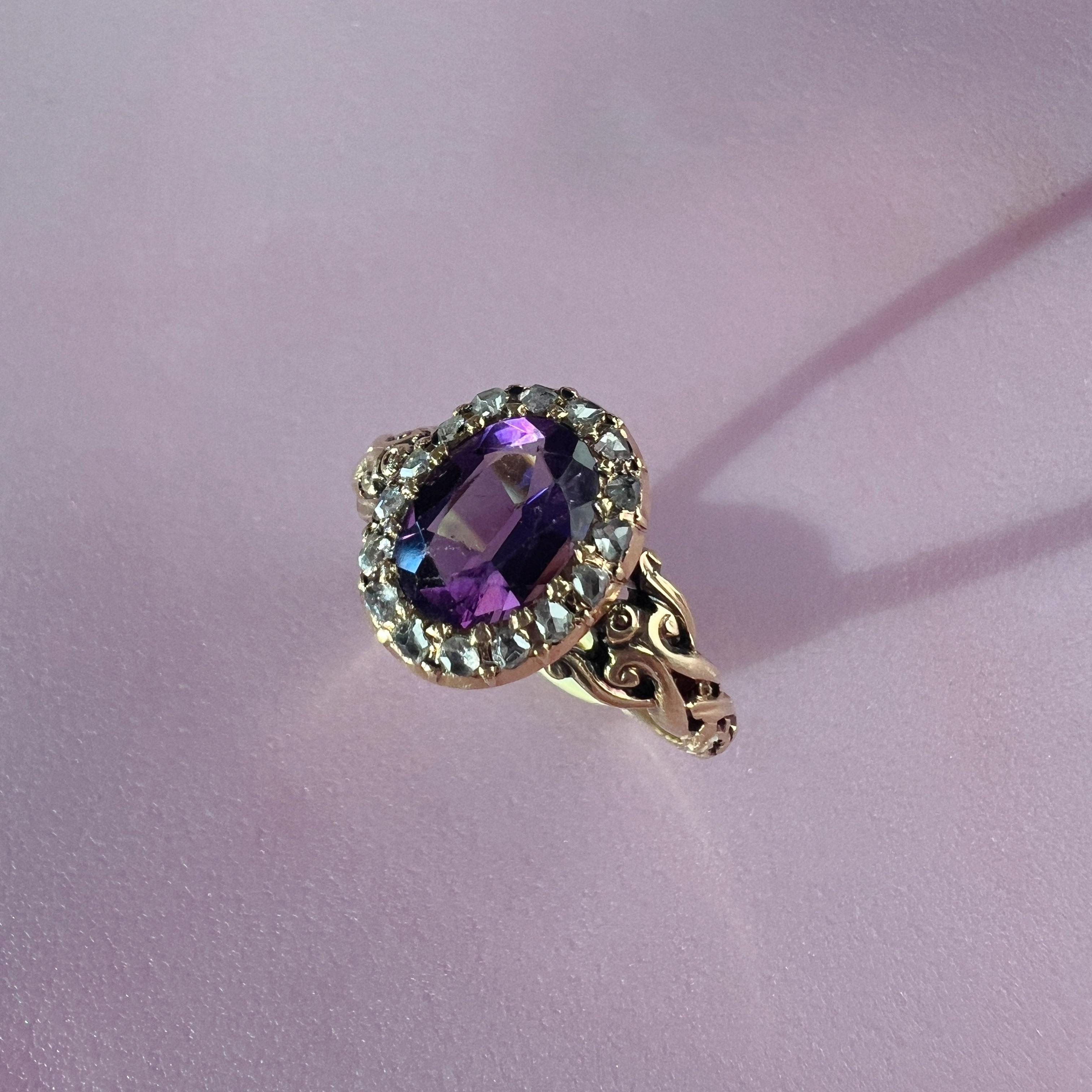 For sale a beautiful 18K gold amethyst diamond ring from the Victorian era.

The center of this ring is an oval-shaped amethyst, with a well saturated purple color that radiates with vibrant violet hues. It has an estimated weight of approximately