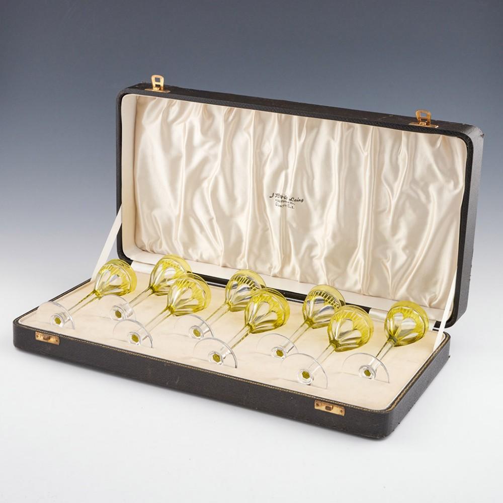 Heading : Set of eight uranium cut to clear liqueur or sherry glasses
Period : 1935-40
Origin : Probably Stourbridge, England. Retailed by JR&W Laing of 85 St Vincent Street, Glasgow. 
Colour : Clear 
Bowl : Round funnel bowls with urnaium cut to