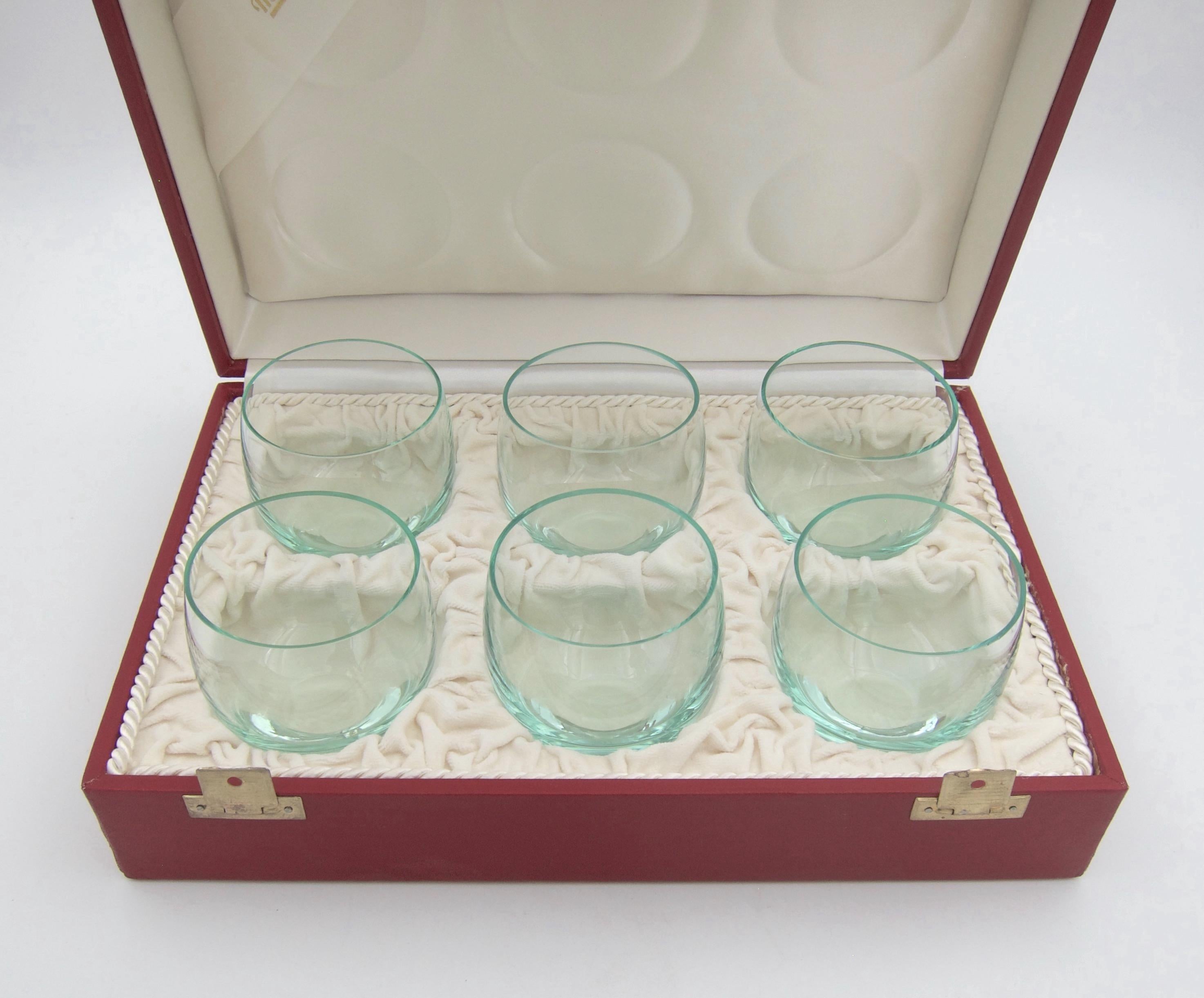 A vintage boxed set of six Moser Culbuto tumbler glasses in Beryl green crystal. The Culbuto collection of drinkware was designed by Rudolf Eschler for Moser in 1935. Although designed during the Art Deco period, the minimalist silhouette became a
