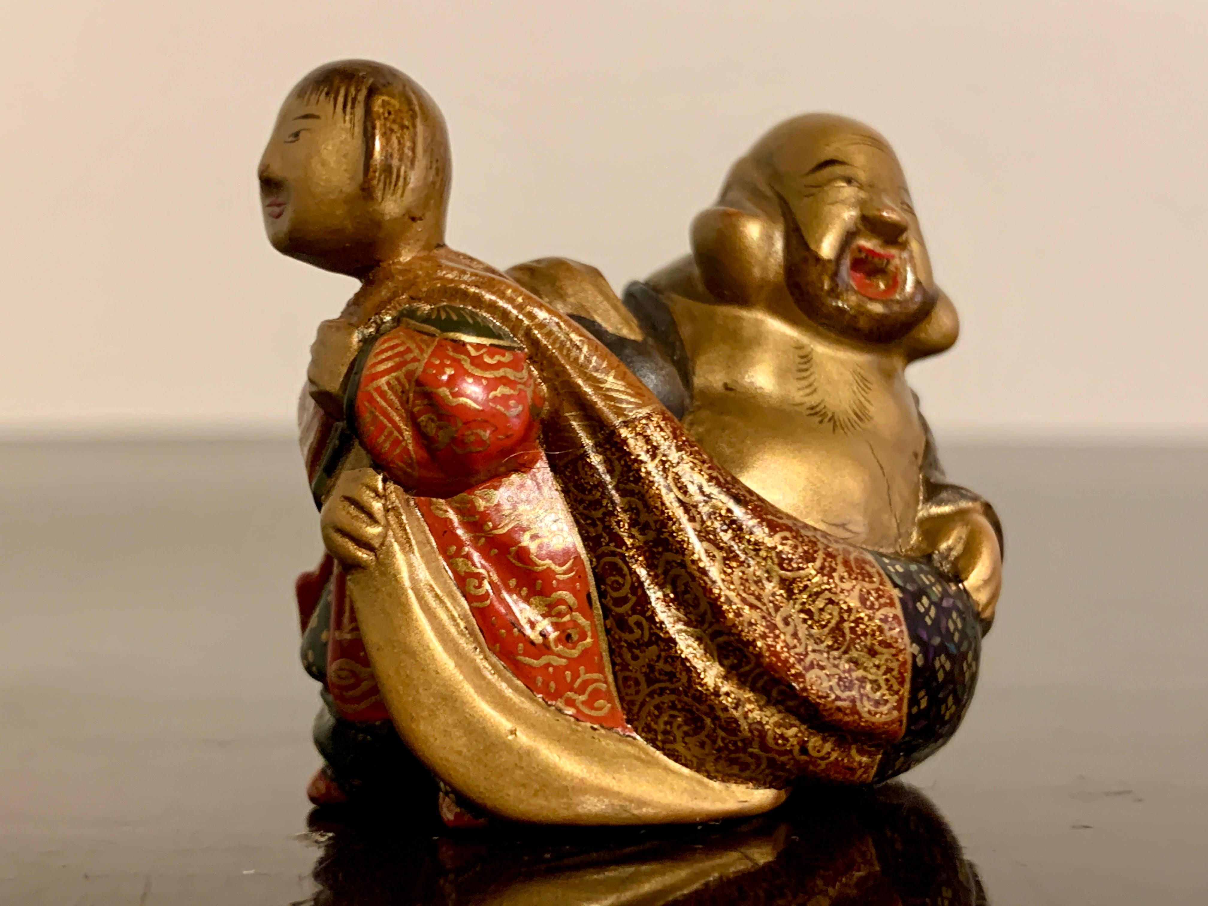 Japanese Boxwood and Lacquer Netsuke of Hotei by Shunsho, Meiji period, circa 1900, Japan For Sale