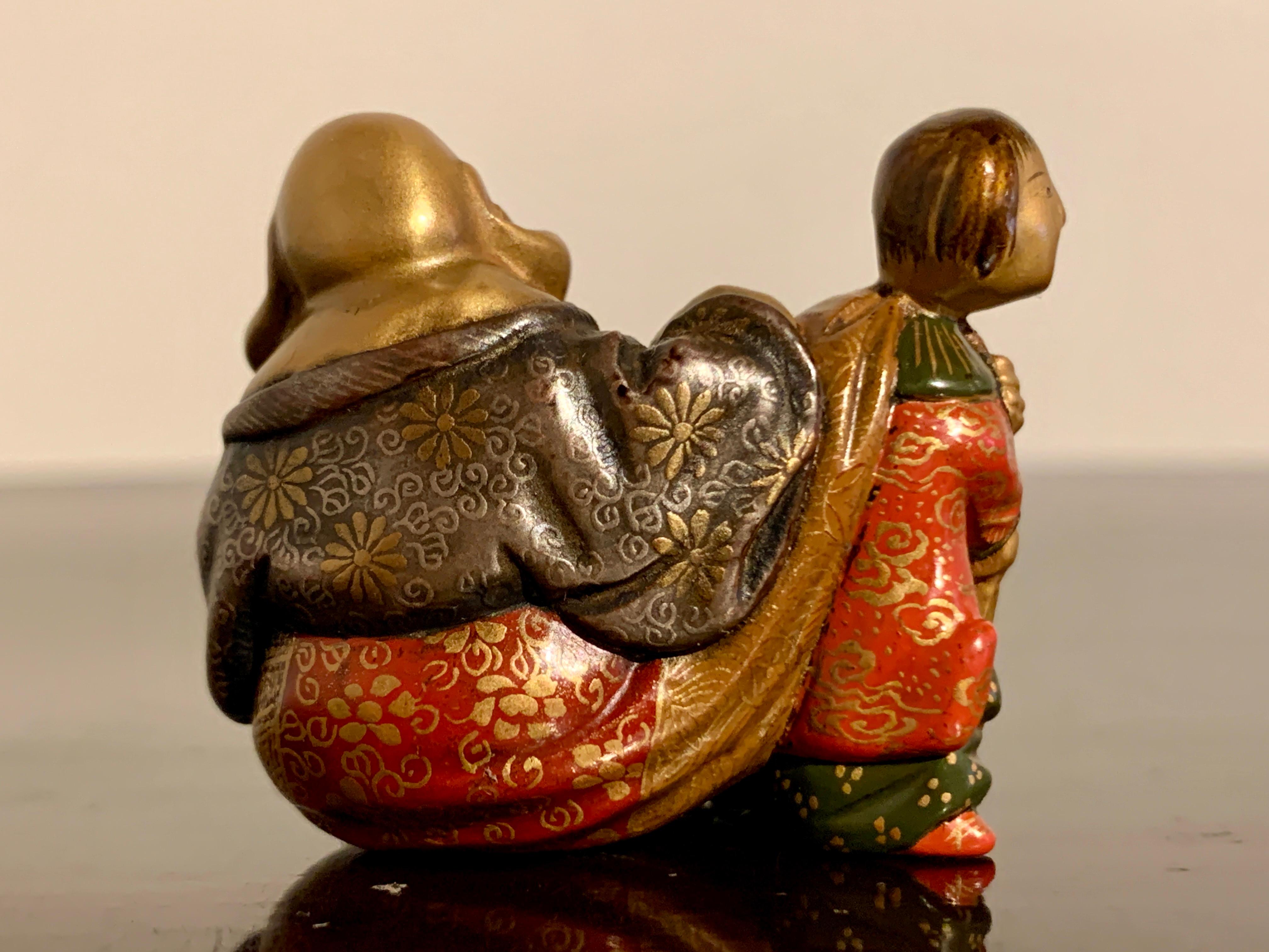 Boxwood and Lacquer Netsuke of Hotei by Shunsho, Meiji period, circa 1900, Japan In Fair Condition For Sale In Austin, TX