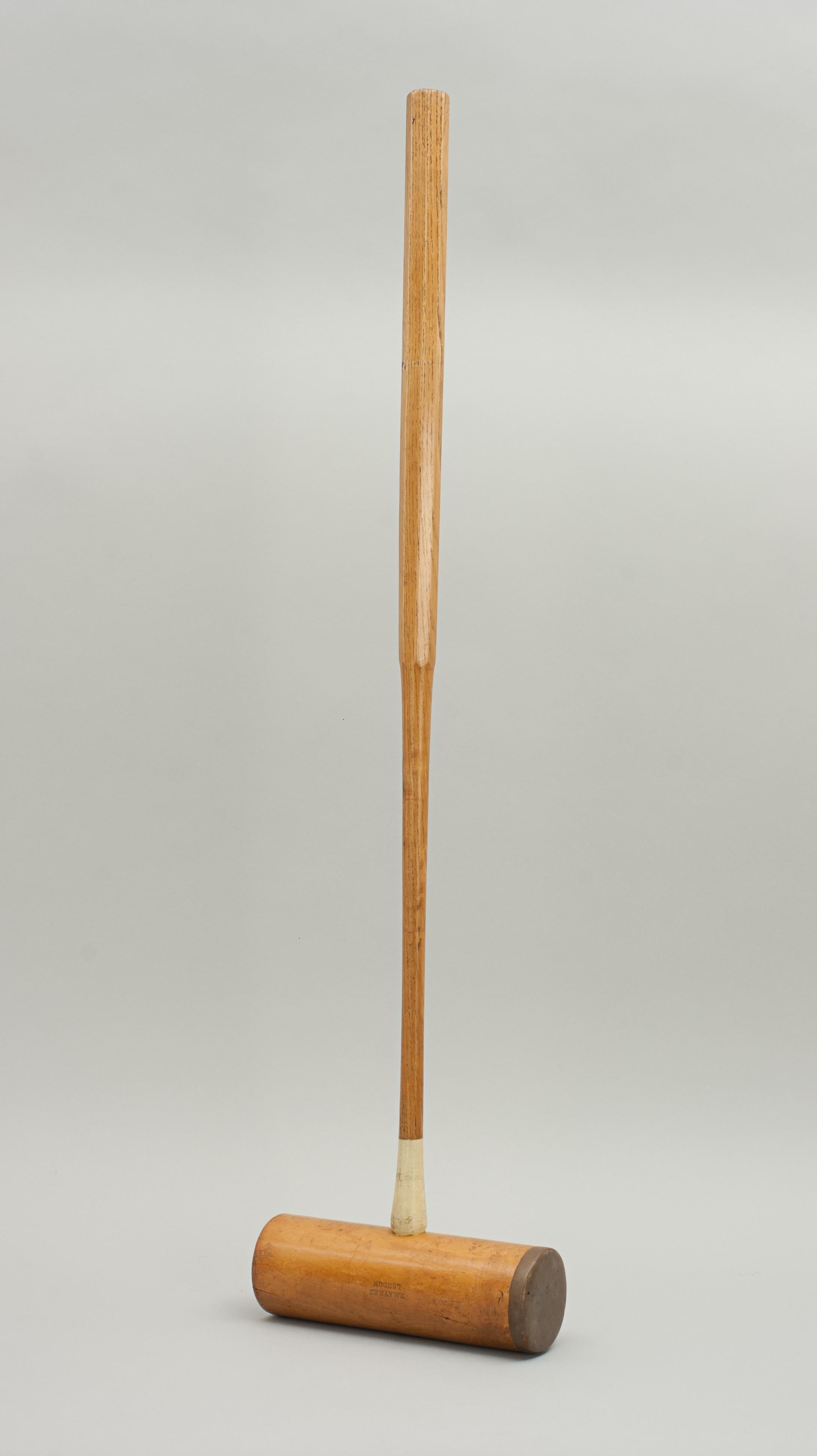 F.H. Ayres Croquet Mallet.
A good vintage dual faced croquet mallet by F.H. Ayres. The handle is made of ash and is fitted to a boxwood head. The head is stamped 'F.H. Ayres, London' and has two playing surfaces. One surface is plain and the other