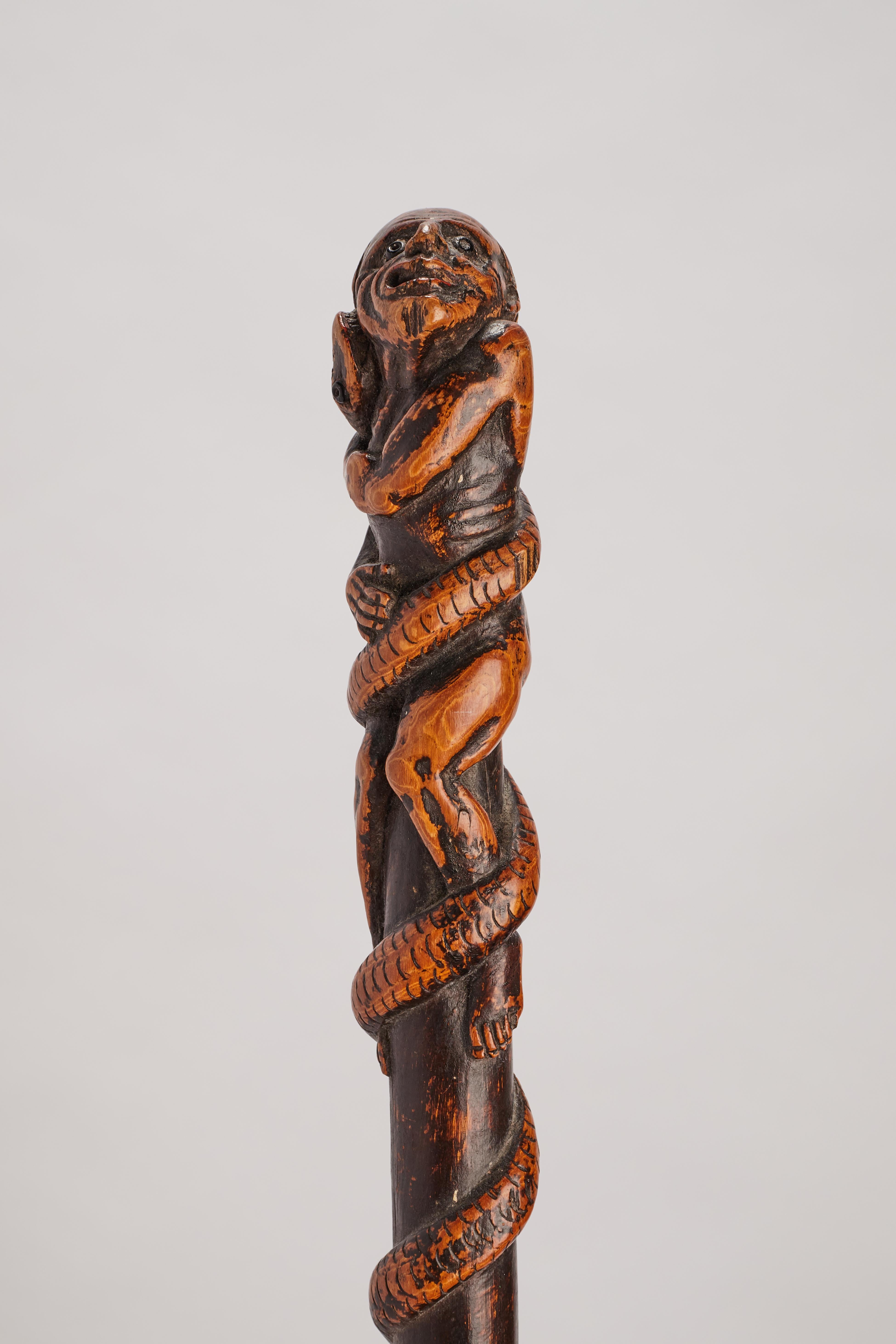 19th Century Boxwood folk art stick depicting a man with snake and lizard, Italy 1850.  For Sale